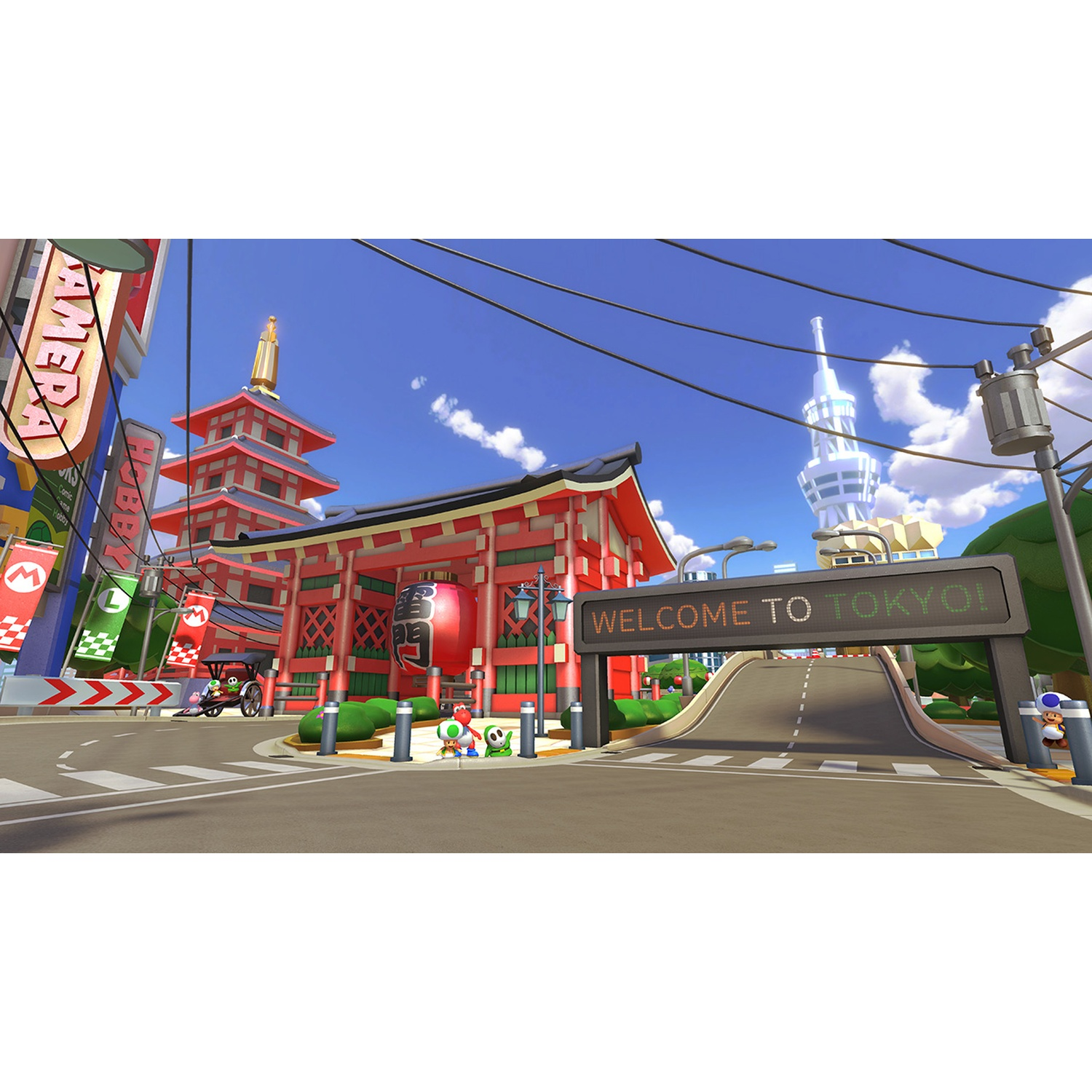 Mario Kart Tokyo track with pagoda, tower, and welcome sign.