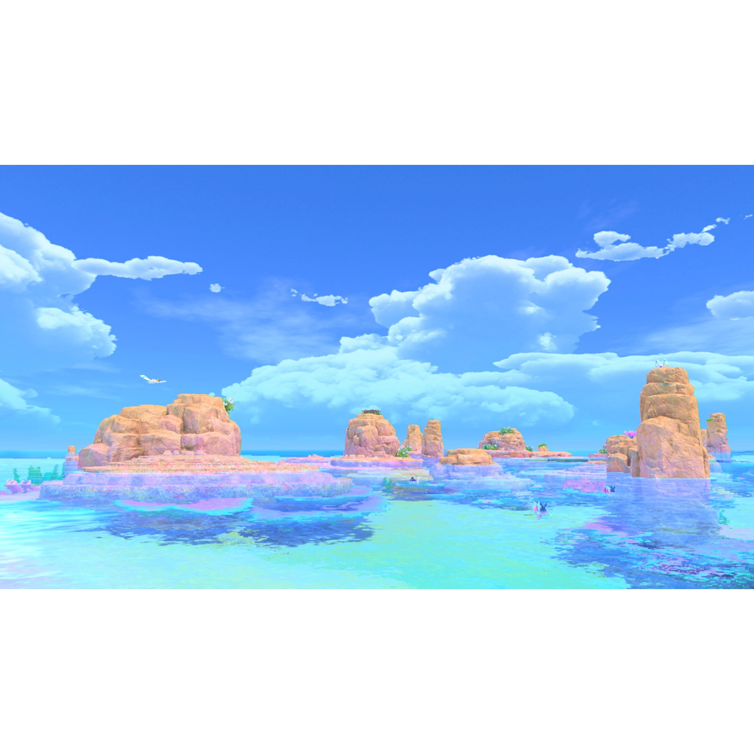 Rock islands in turquoise water under a blue sky with clouds.