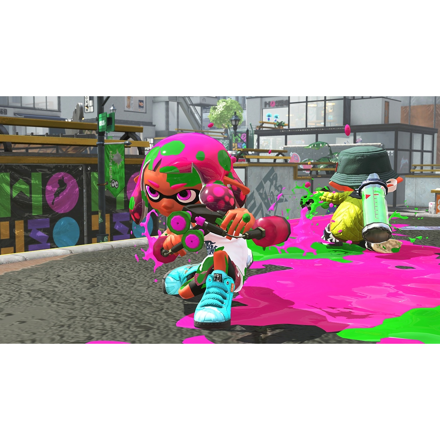 Two characters with pink and green ink on an urban background splattering paint.