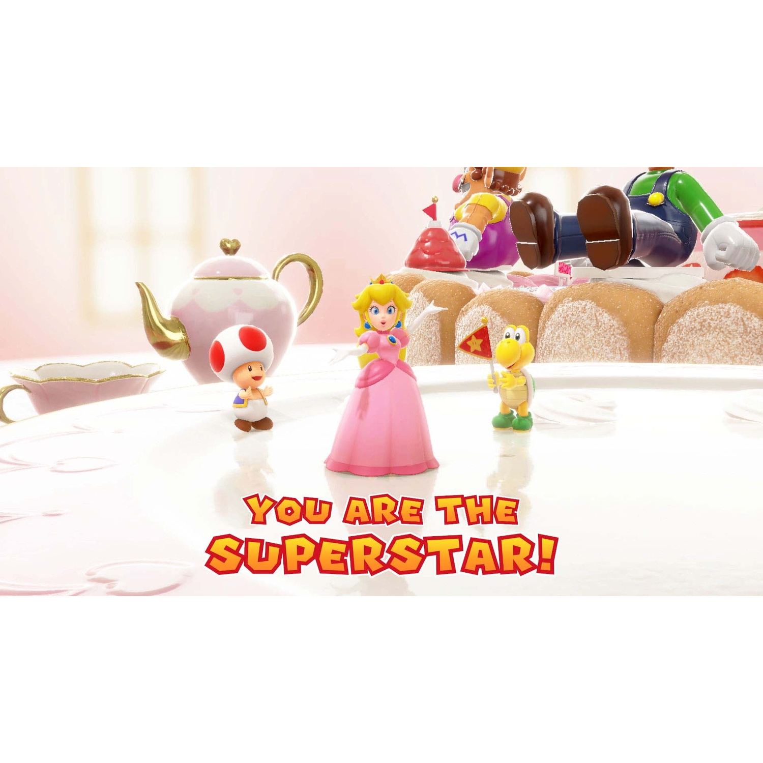 Princess Peach, Toad, and Koopa stand on a table with "YOU ARE THE SUPERSTAR!"