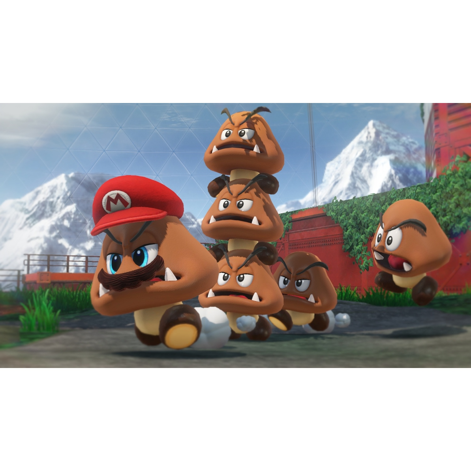 A group of Goombas, some stacked, with Mario in front, against snowy mountains.
