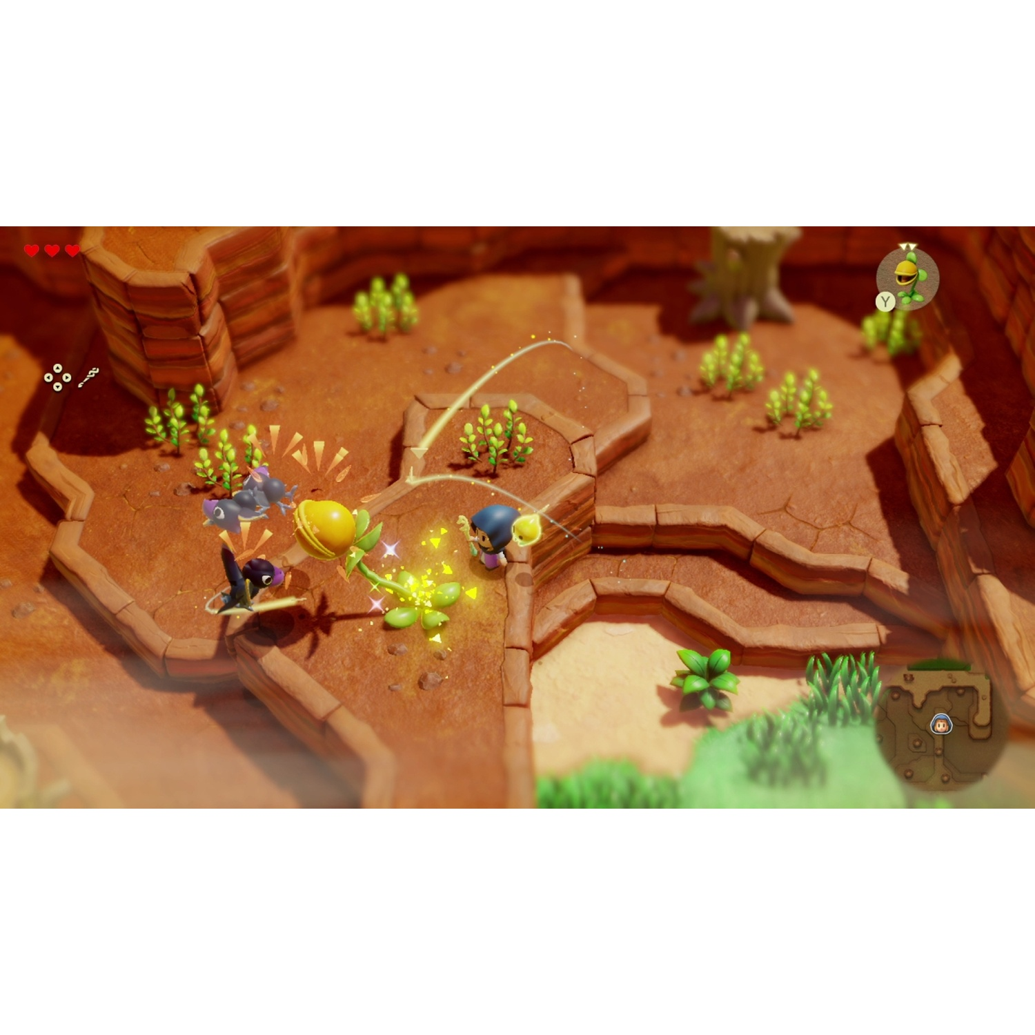 A character with blue hair fights a yellow plant and a bat enemy.