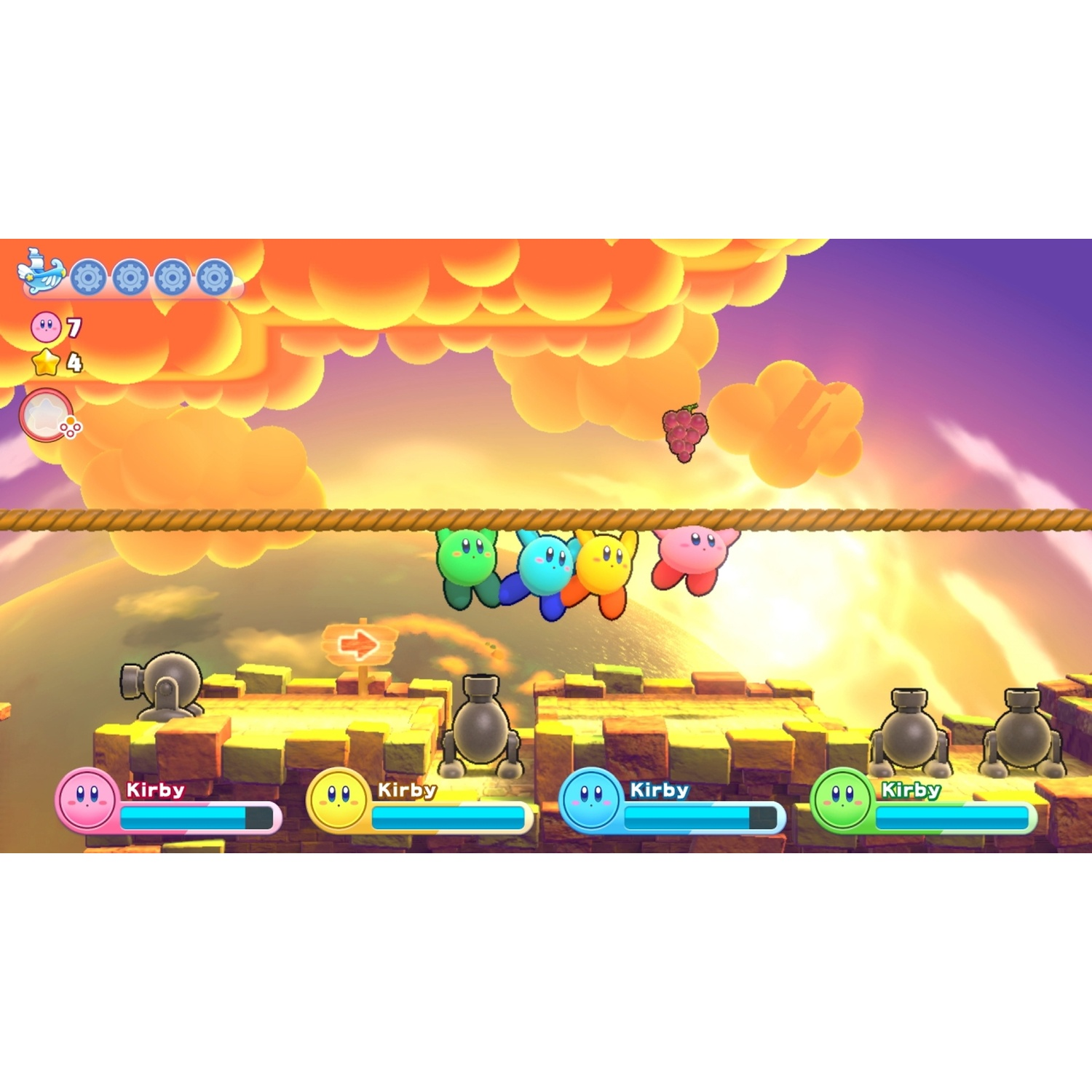 Four Kirbys hang from a rope in front of a sunlit cloudscape.