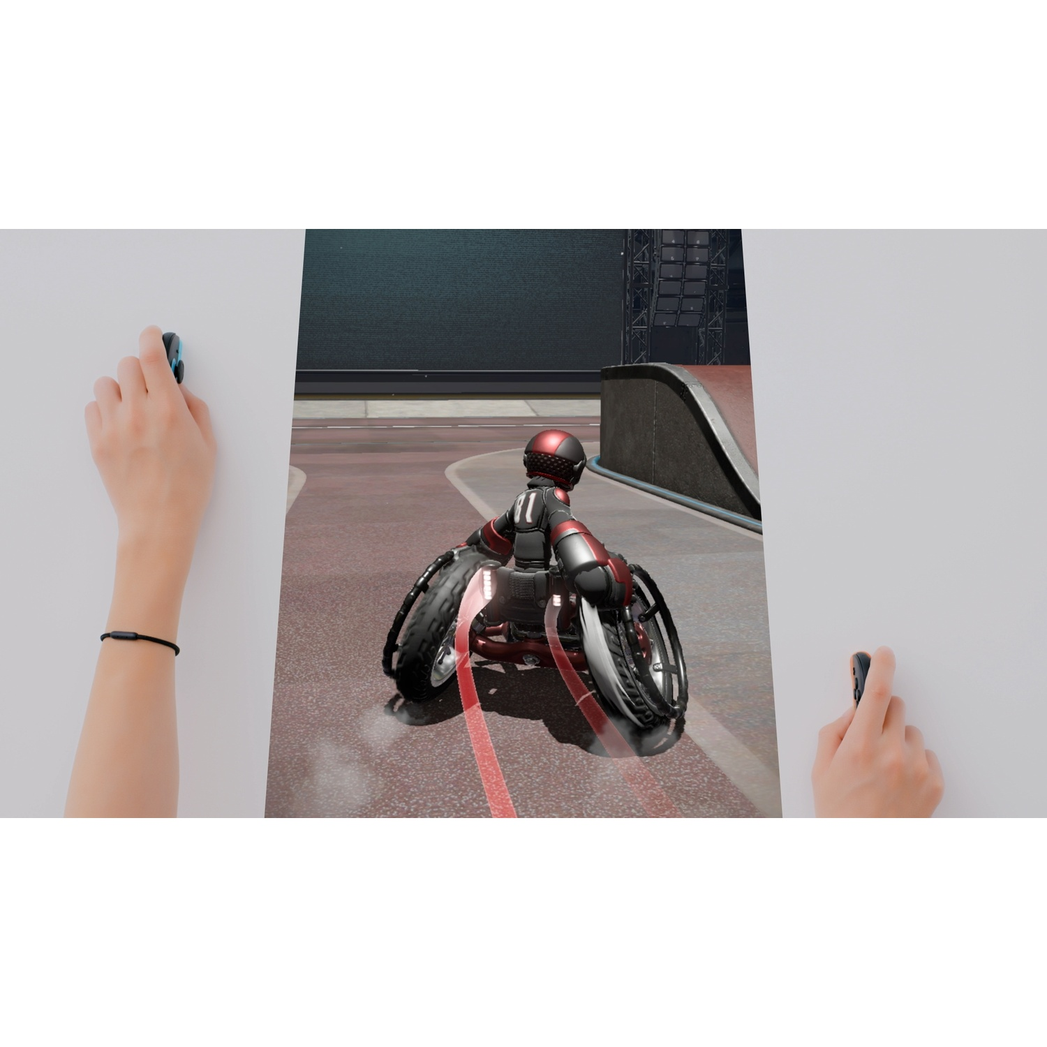 A person in a red and black racing suit on a wheelchair on a track.