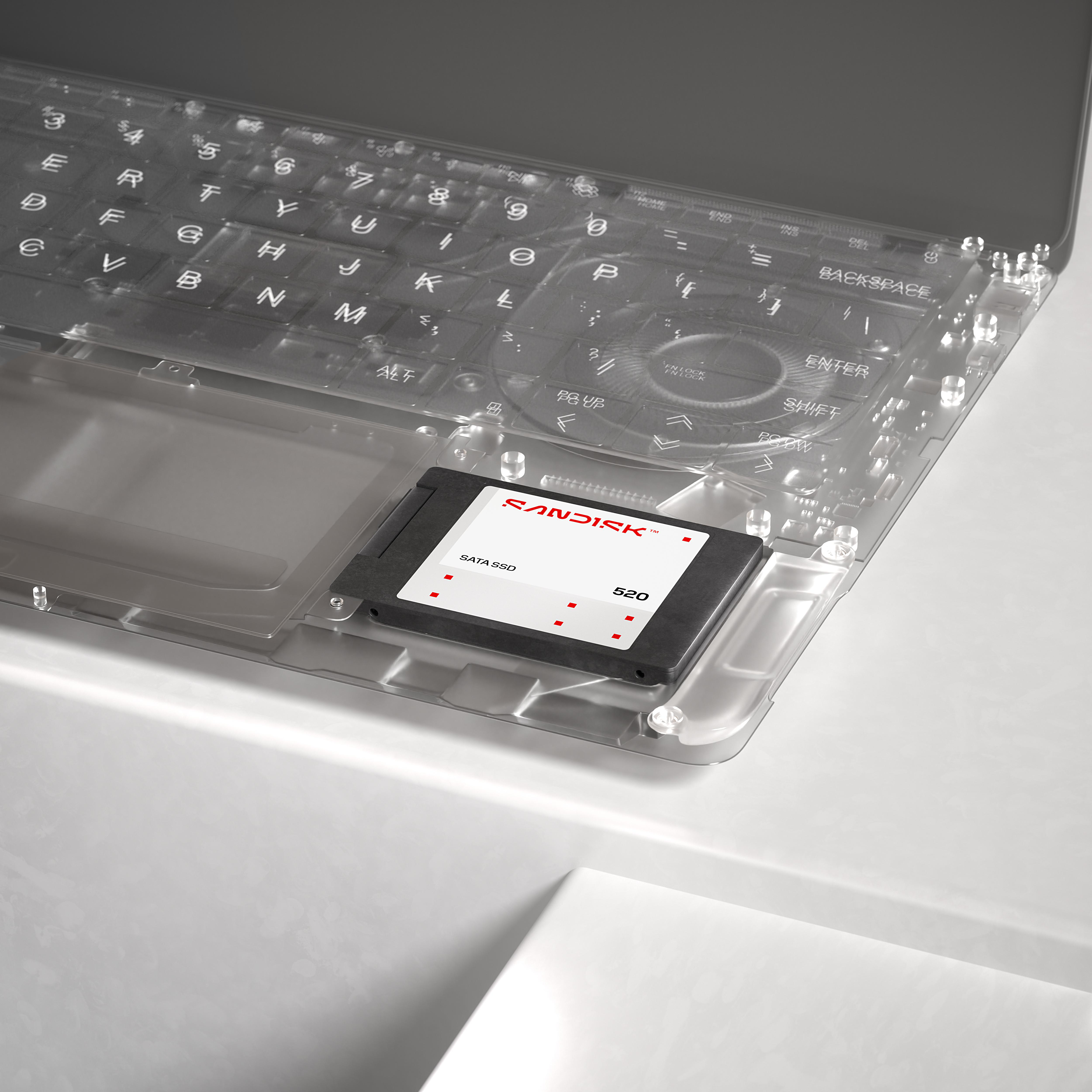 Ein Sandisk SATA SSD 520-Laufwerk in einem transparenten Laptop-Gehäuse.