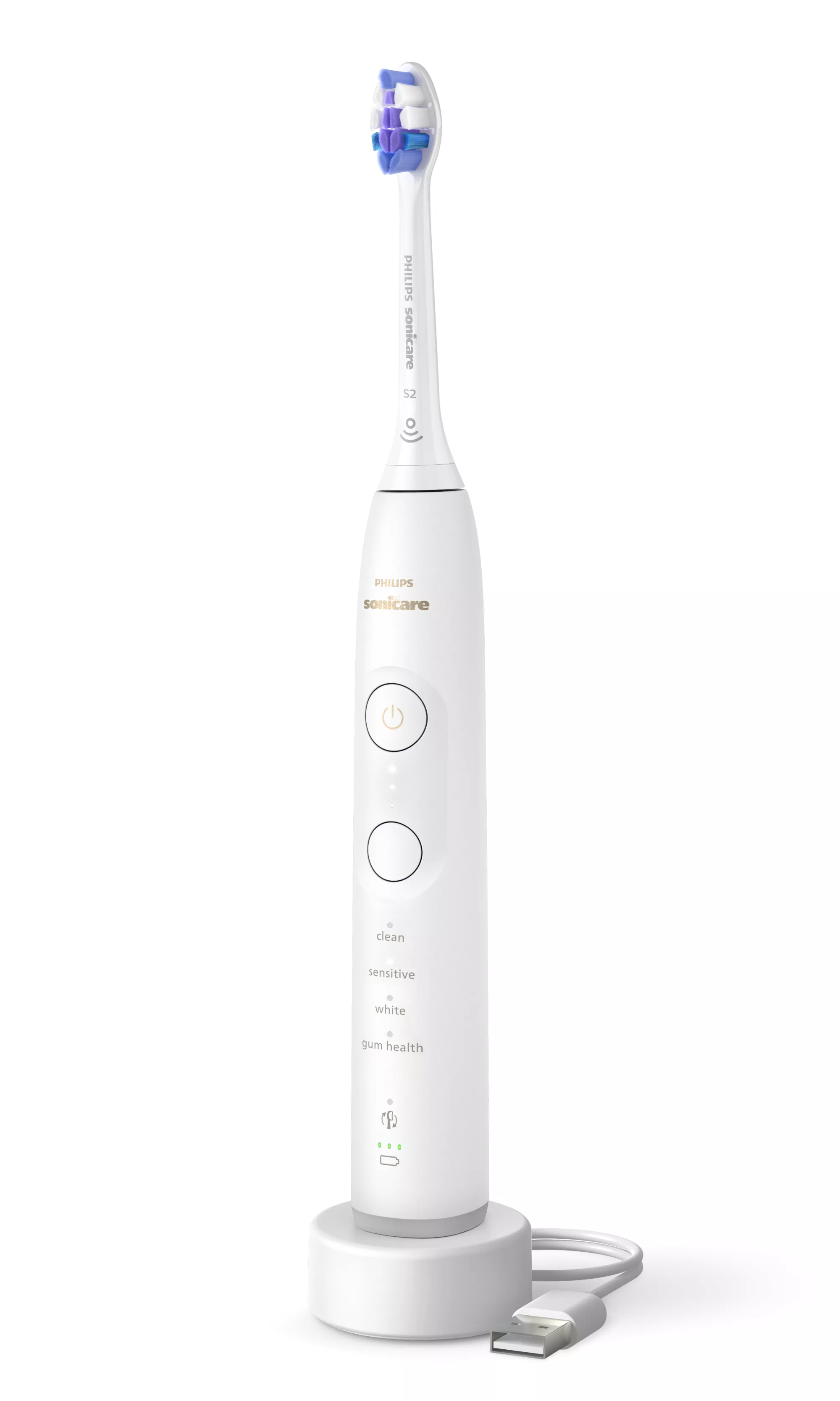Eine weiße Philips Sonicare elektrische Zahnbürste mit blau-violettem Bürstenkopf auf weißer Ladestation mit USB-Kabel.
