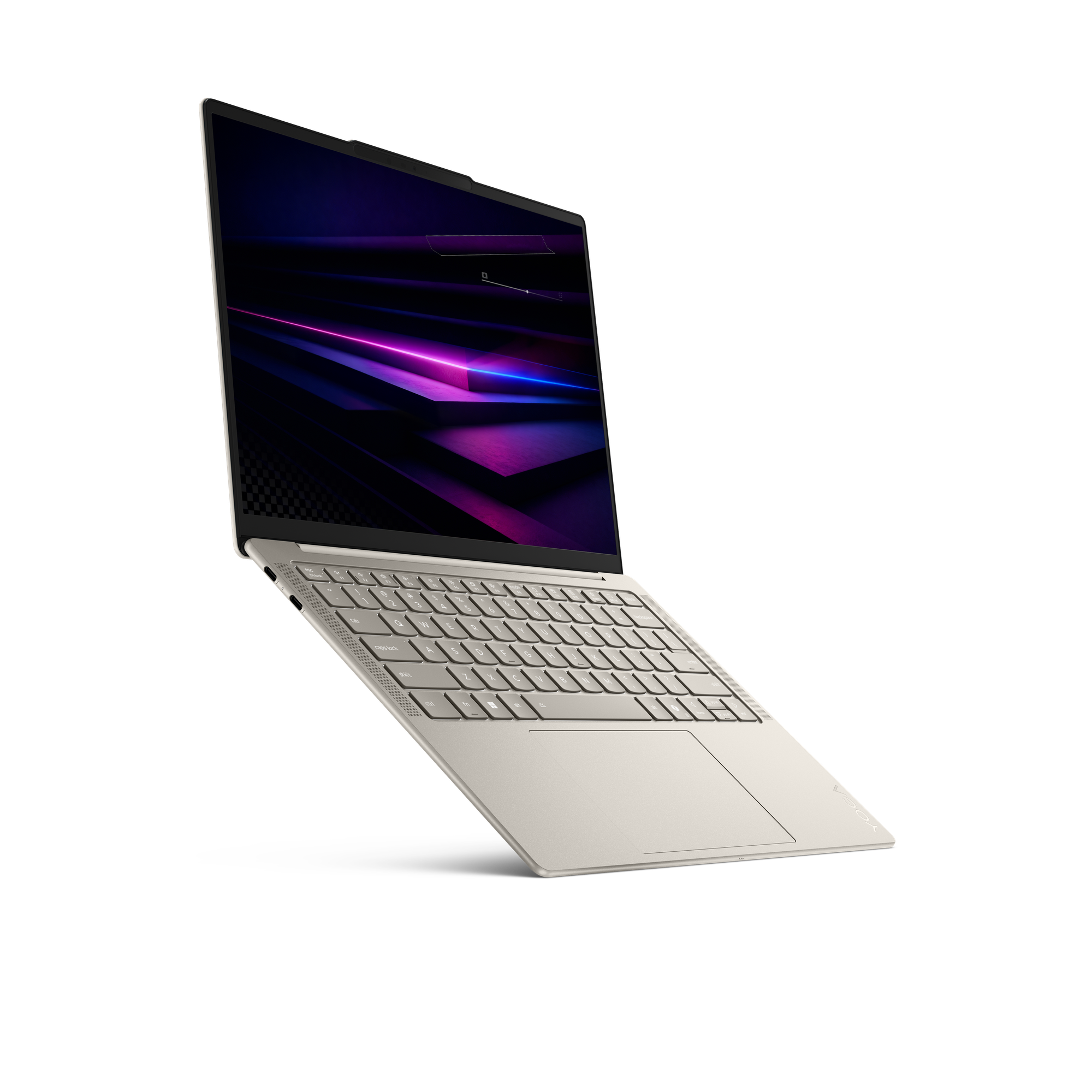 Ein hellgoldener Laptop mit einem dunklen, abstrakten Hintergrund auf dem Bildschirm.