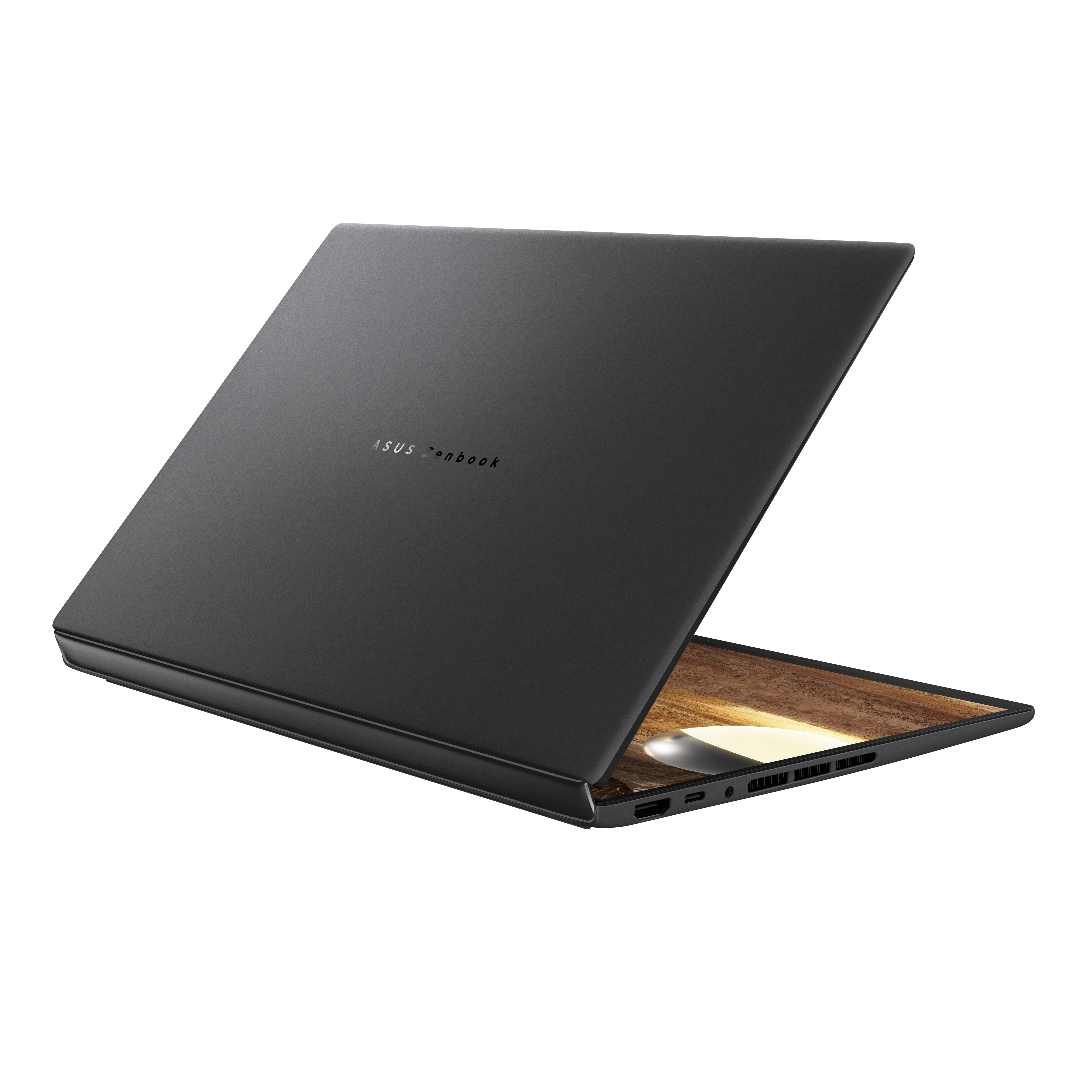 Asus Zenbook logolu kapalı, koyu renkli bir dizüstü bilgisayar.