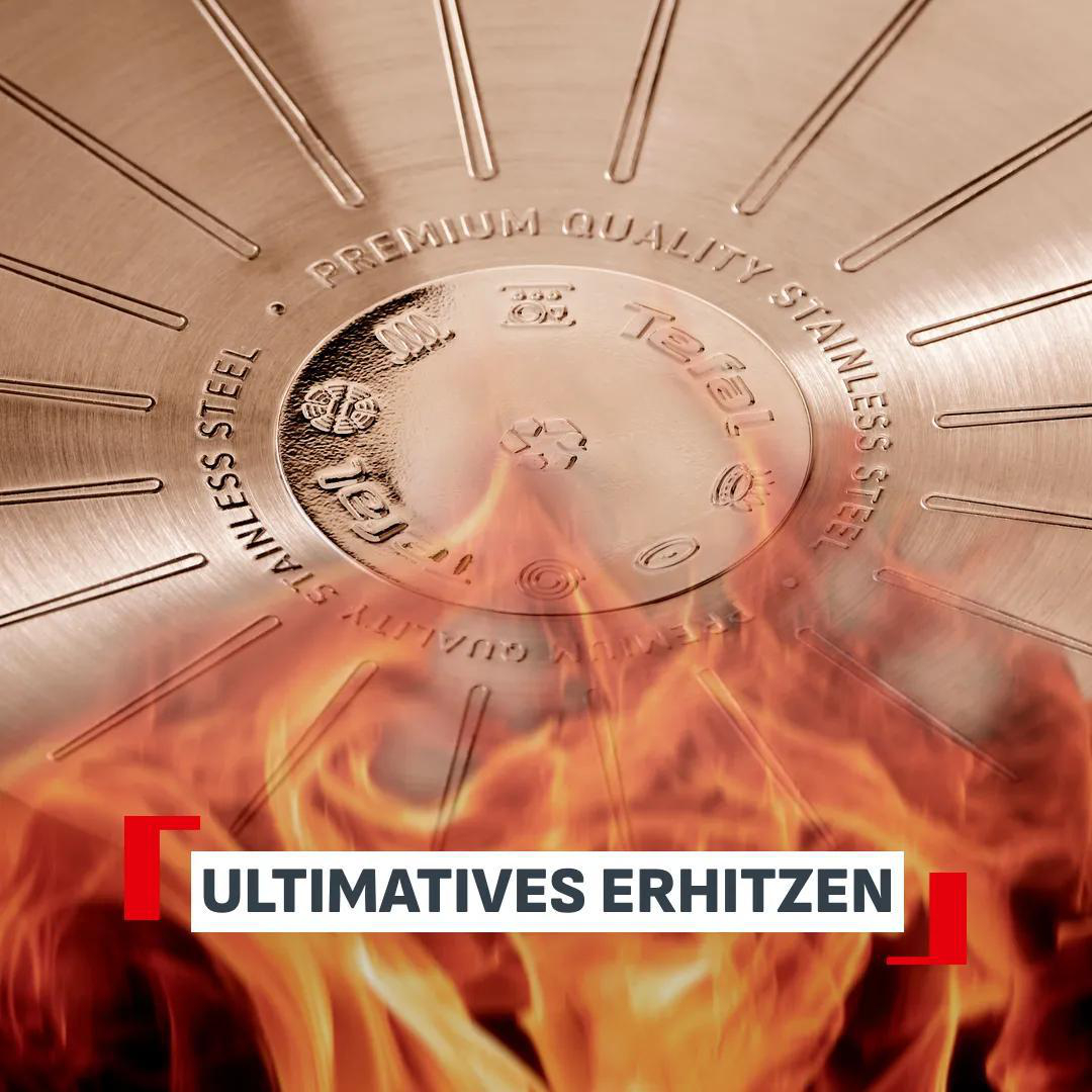 Edelstahlpfannenboden mit Flammen und Schriftzug.