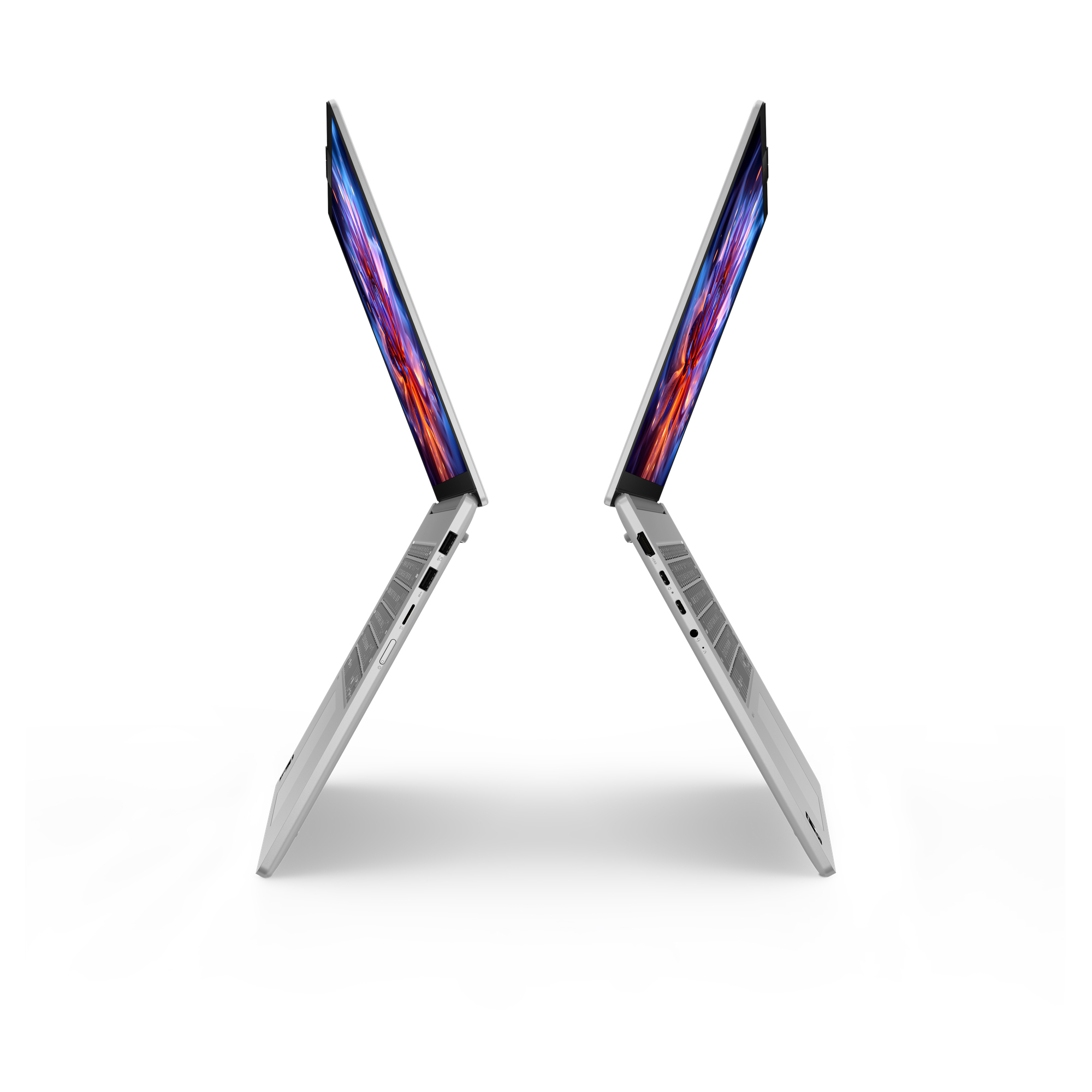 Due laptop mostrati di lato, con schermi colorati.
