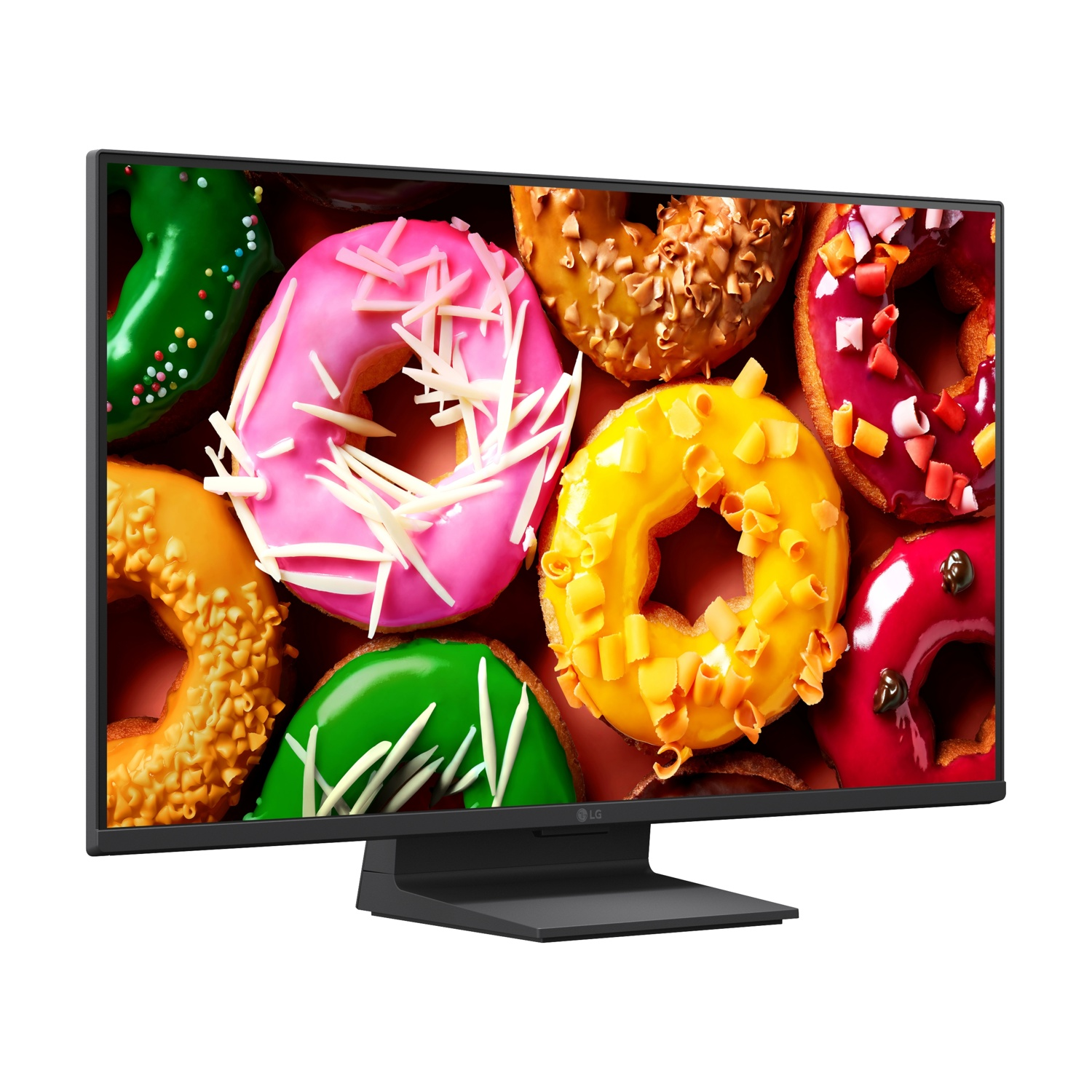 Un monitor mostra ciambelle colorate con glassa e codette.
