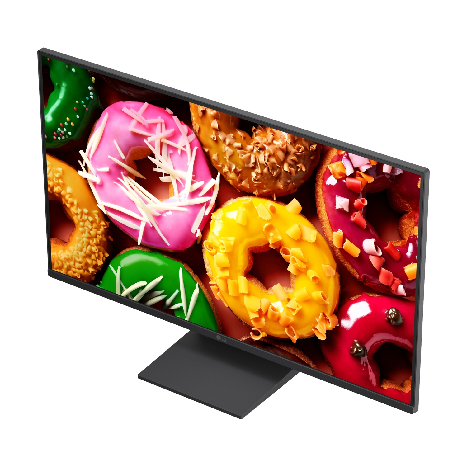 Un monitor mostra un primo piano di ciambelle colorate con varie glasse.