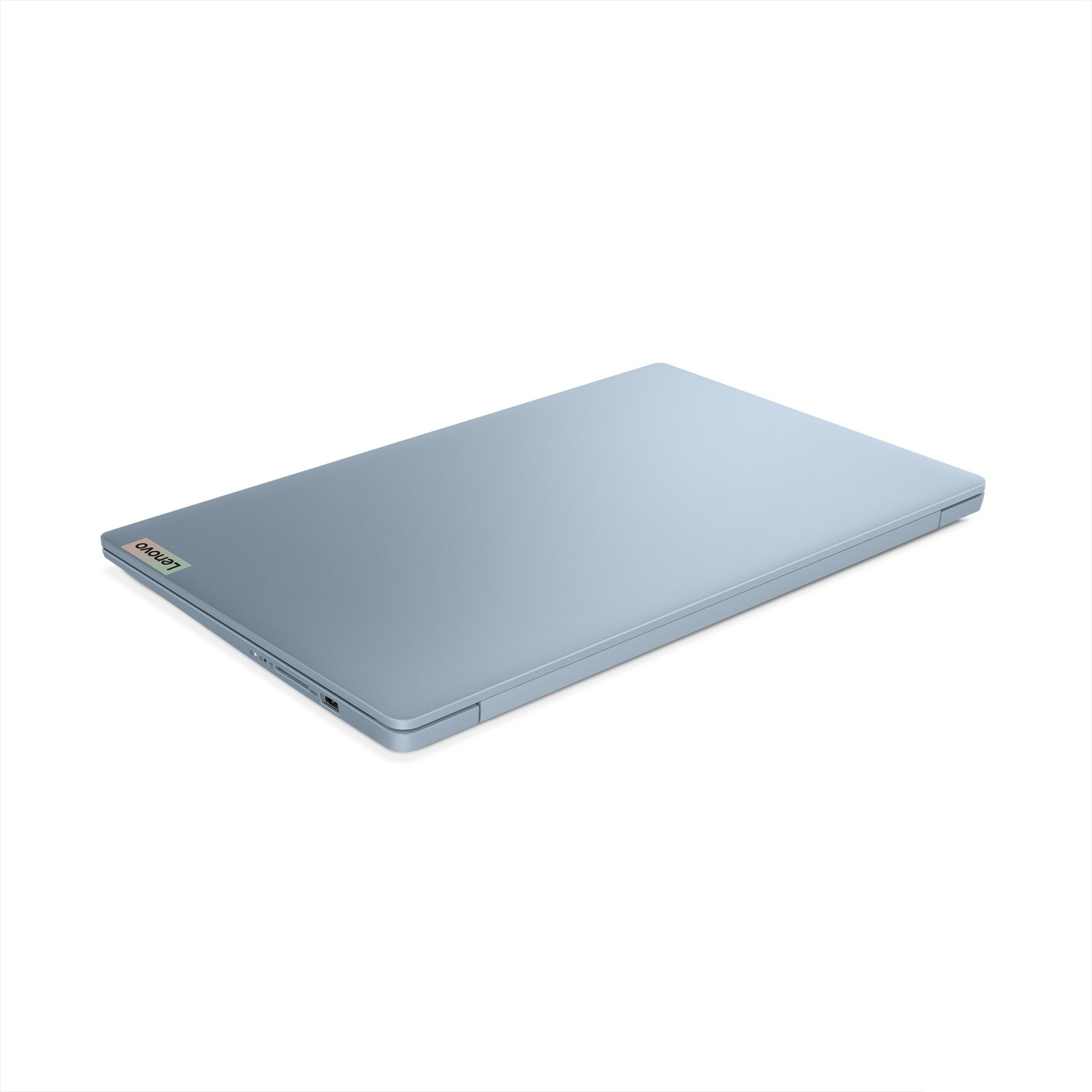 Un laptop chiuso, azzurro, con logo Lenovo argentato, su sfondo bianco.