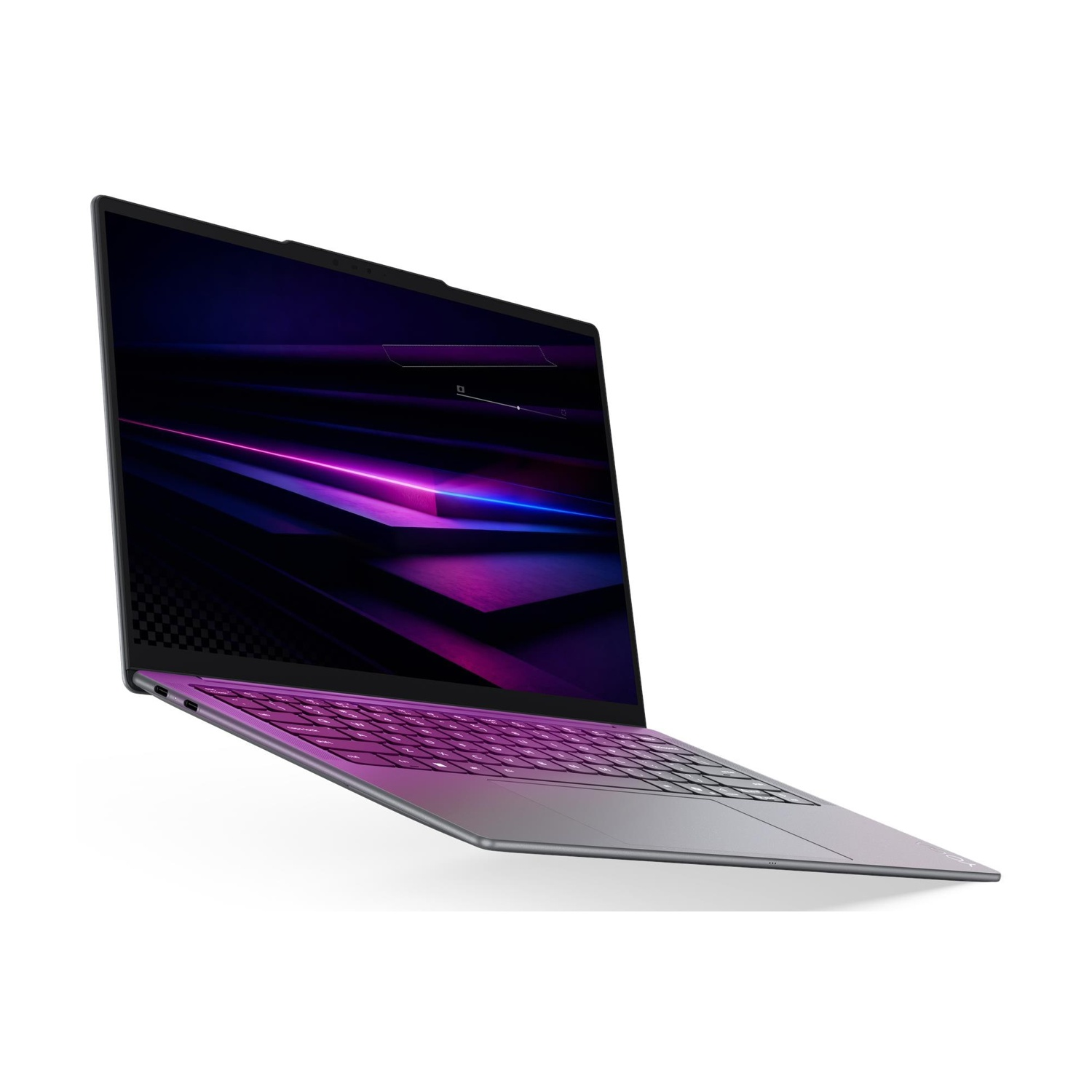 Un laptop grigio con tastiera illuminata e grafica di sfondo scura al neon.