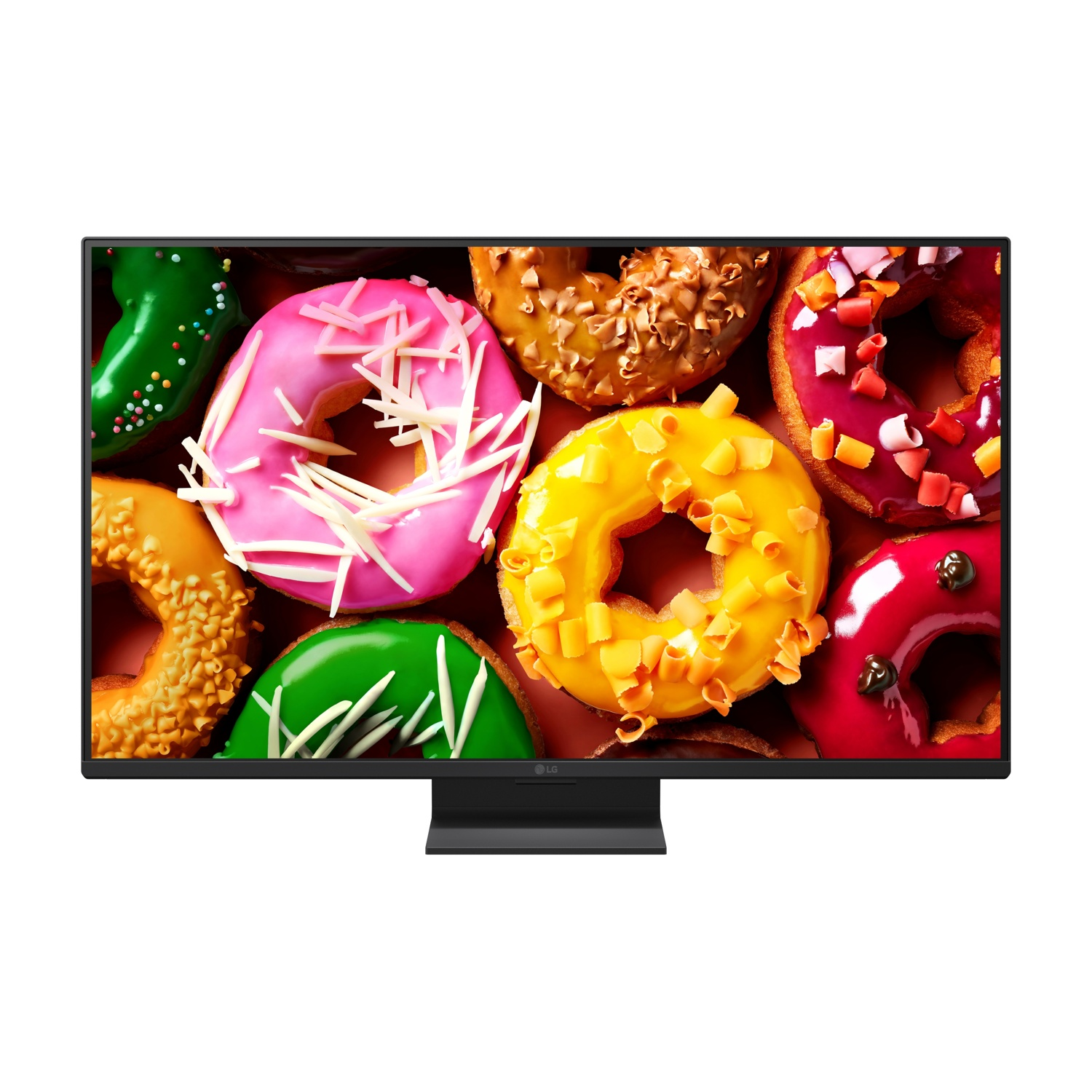 Un monitor mostra ciambelle colorate con glassa e zuccherini.