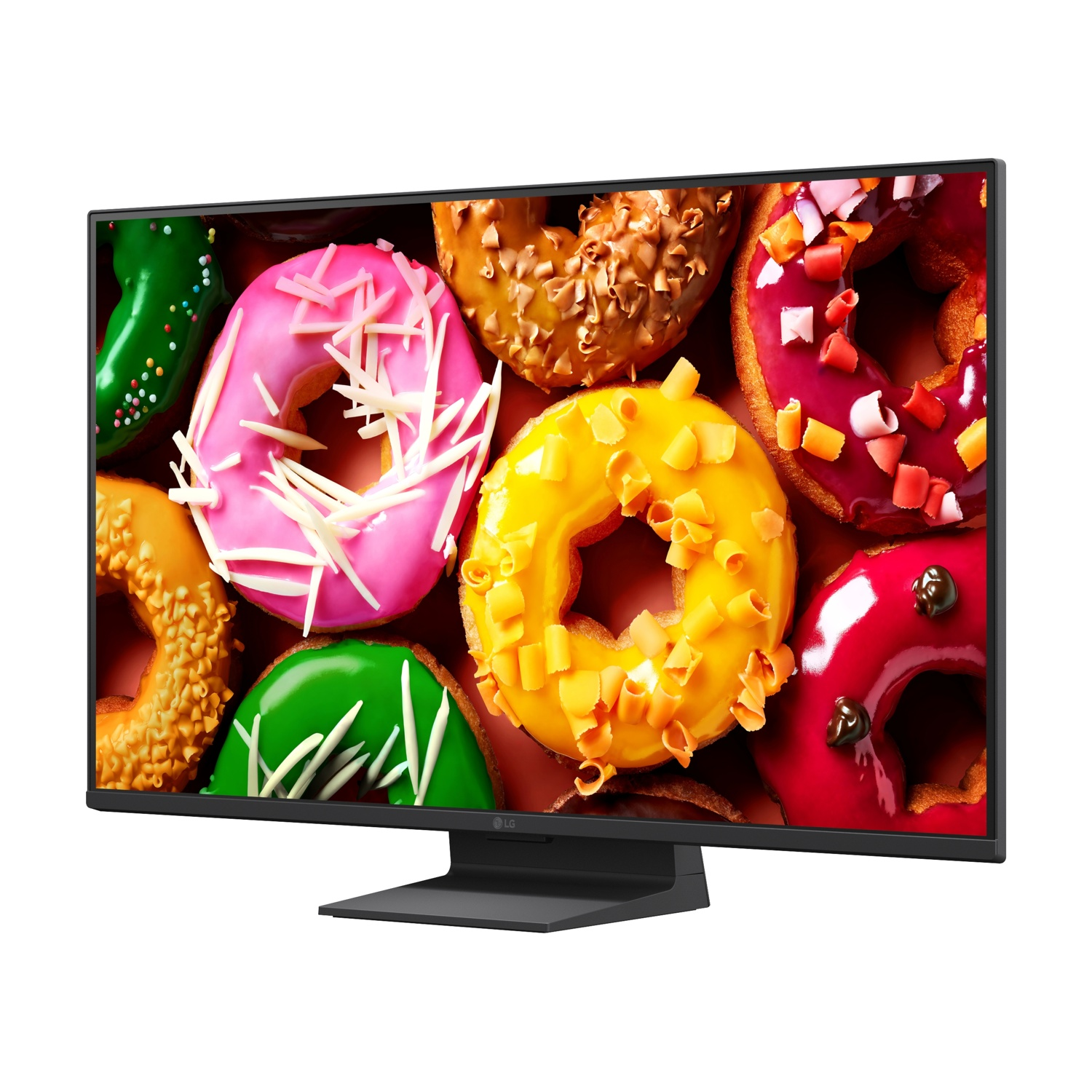 Un monitor mostra ciambelle colorate con glassa e codette.