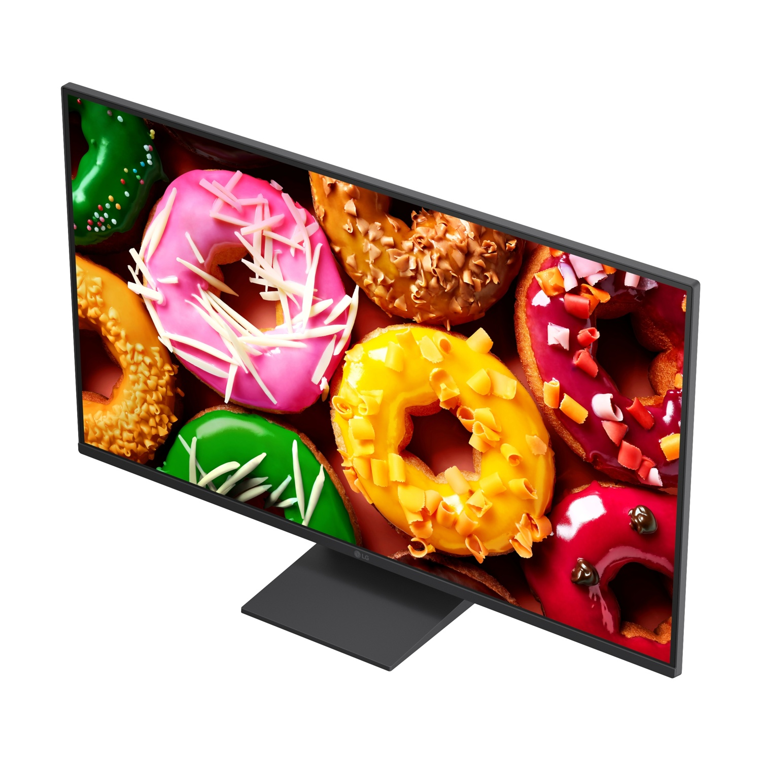 Un monitor mostra ciambelle colorate con glassa e zuccherini.