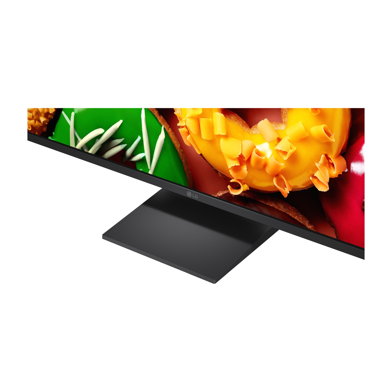 Un monitor LG mostra ciambelle colorate con glassa e codette.