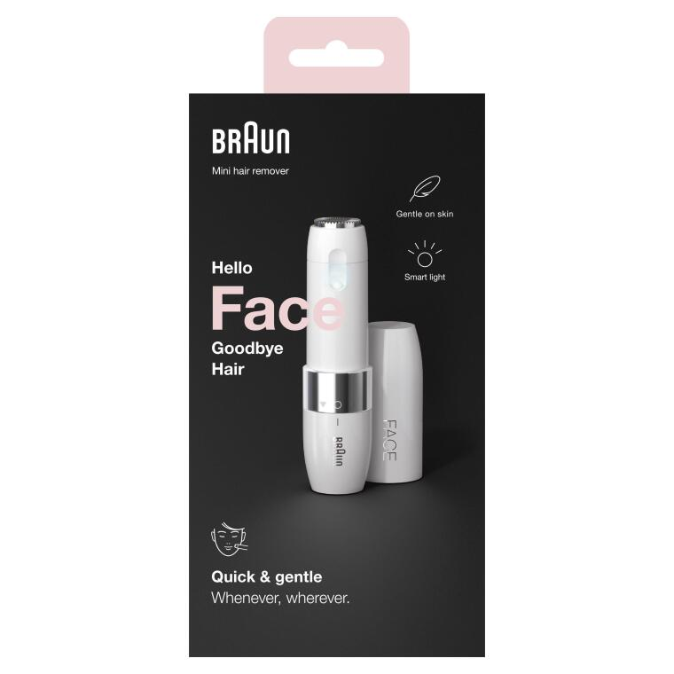 Braun mini tüy dökücü ambalajında. Gümüş aksanlı beyaz cihaz. Metin: Hello Face Goodbye Hair.