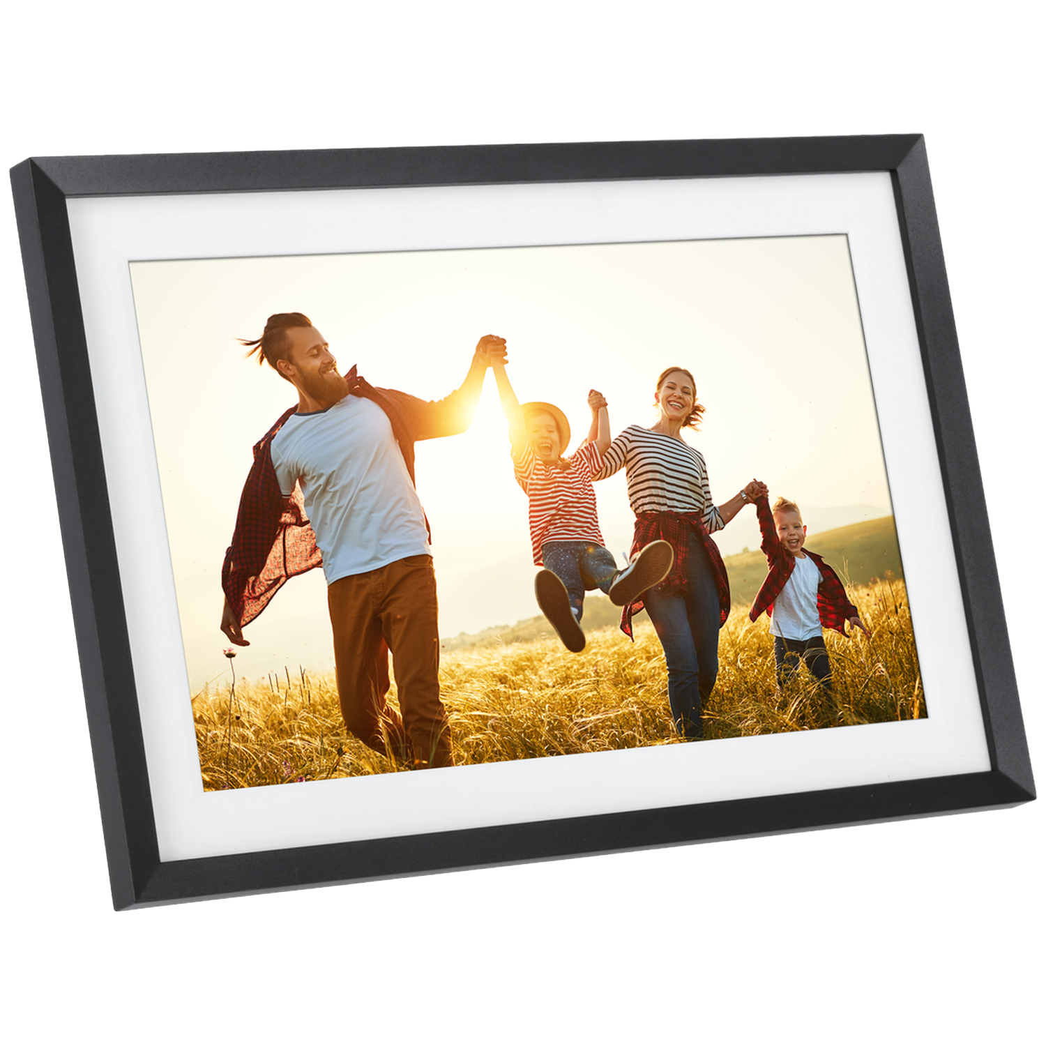 A happy family runs laughing through a golden field at sunset.