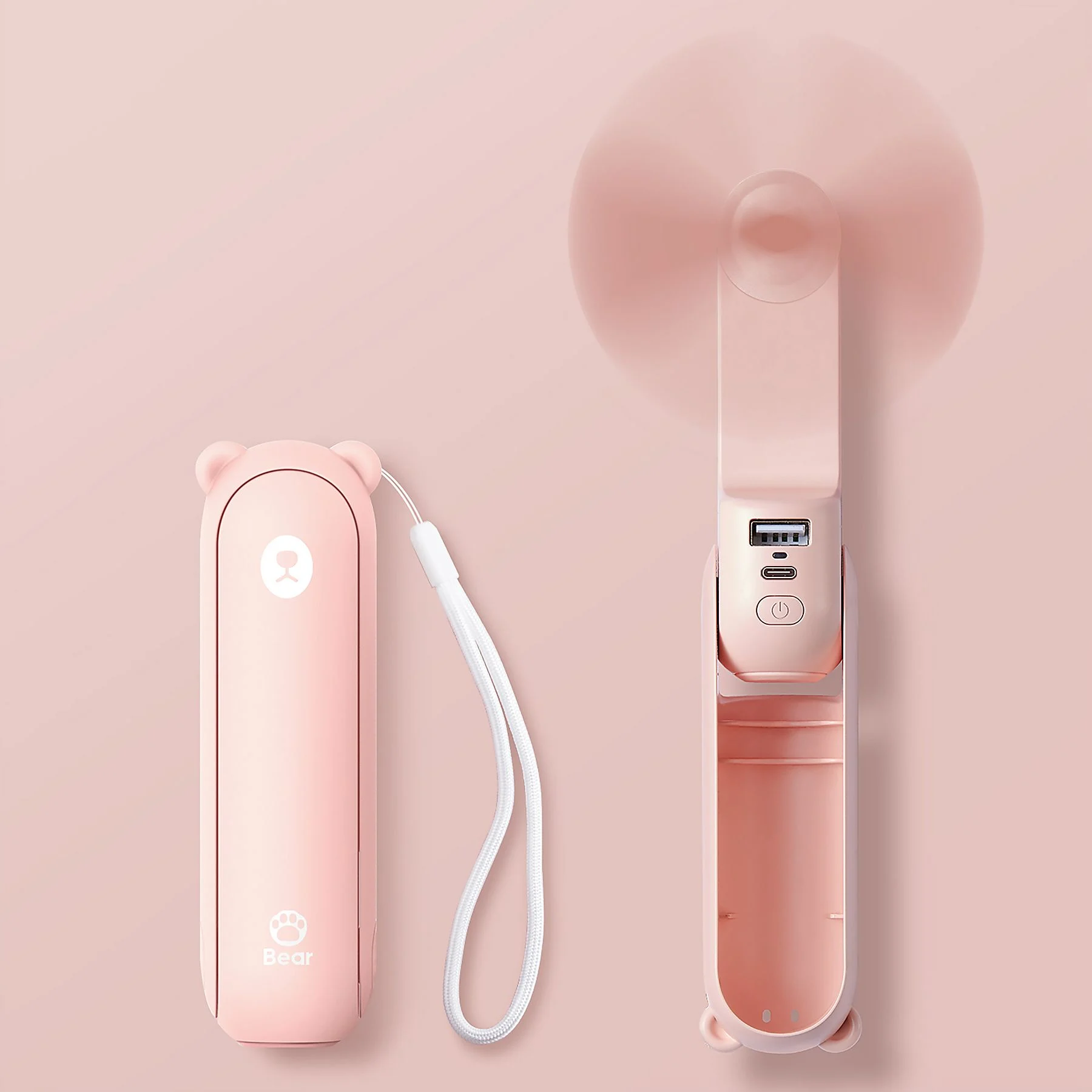 Un ventilador de mano rosa y su funda plegada sobre un fondo rosa.