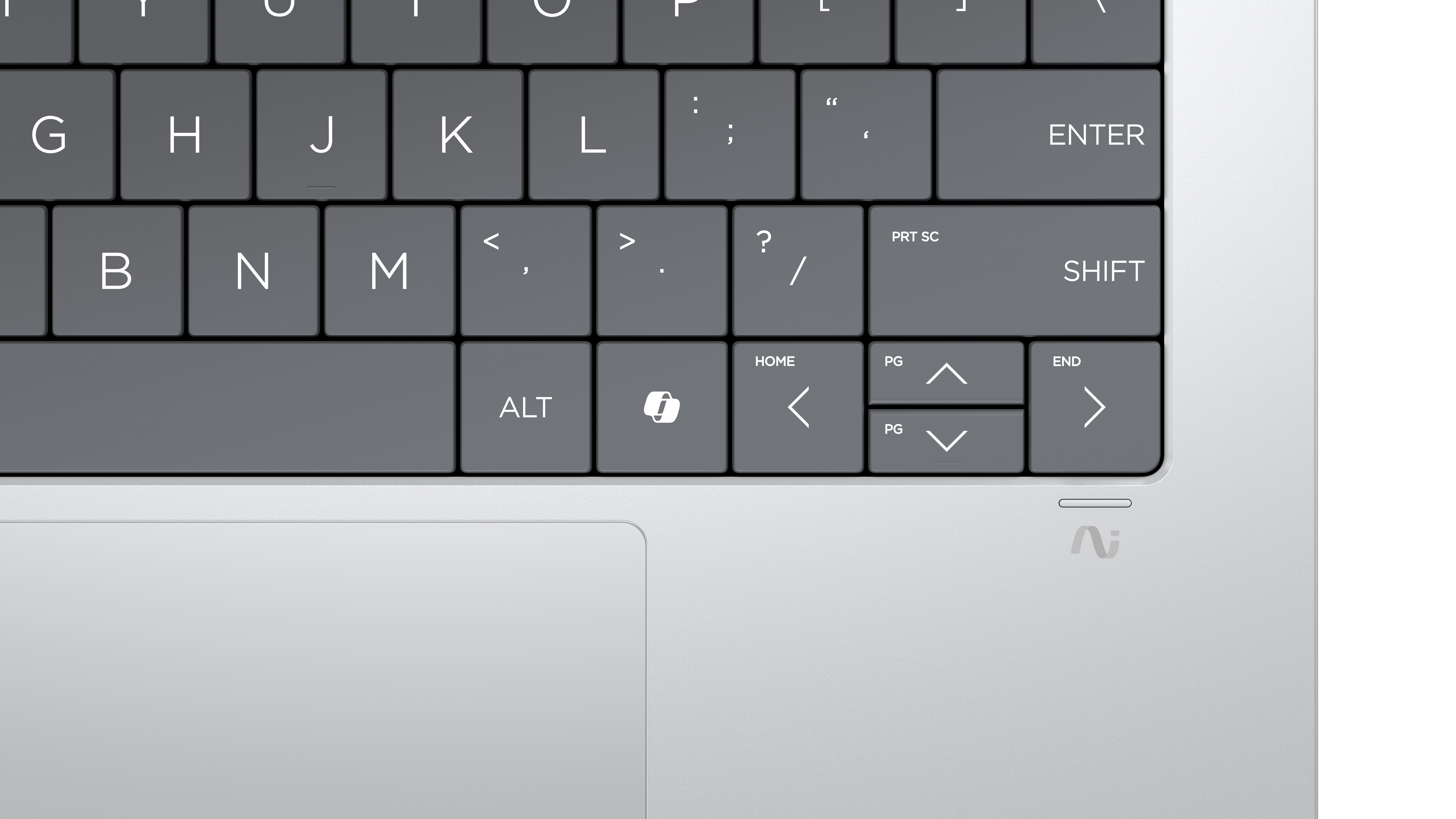 Nahaufnahme einer grauen Laptop-Tastatur mit sichtbaren Tasten B, N, M, G, H, J, K, L.