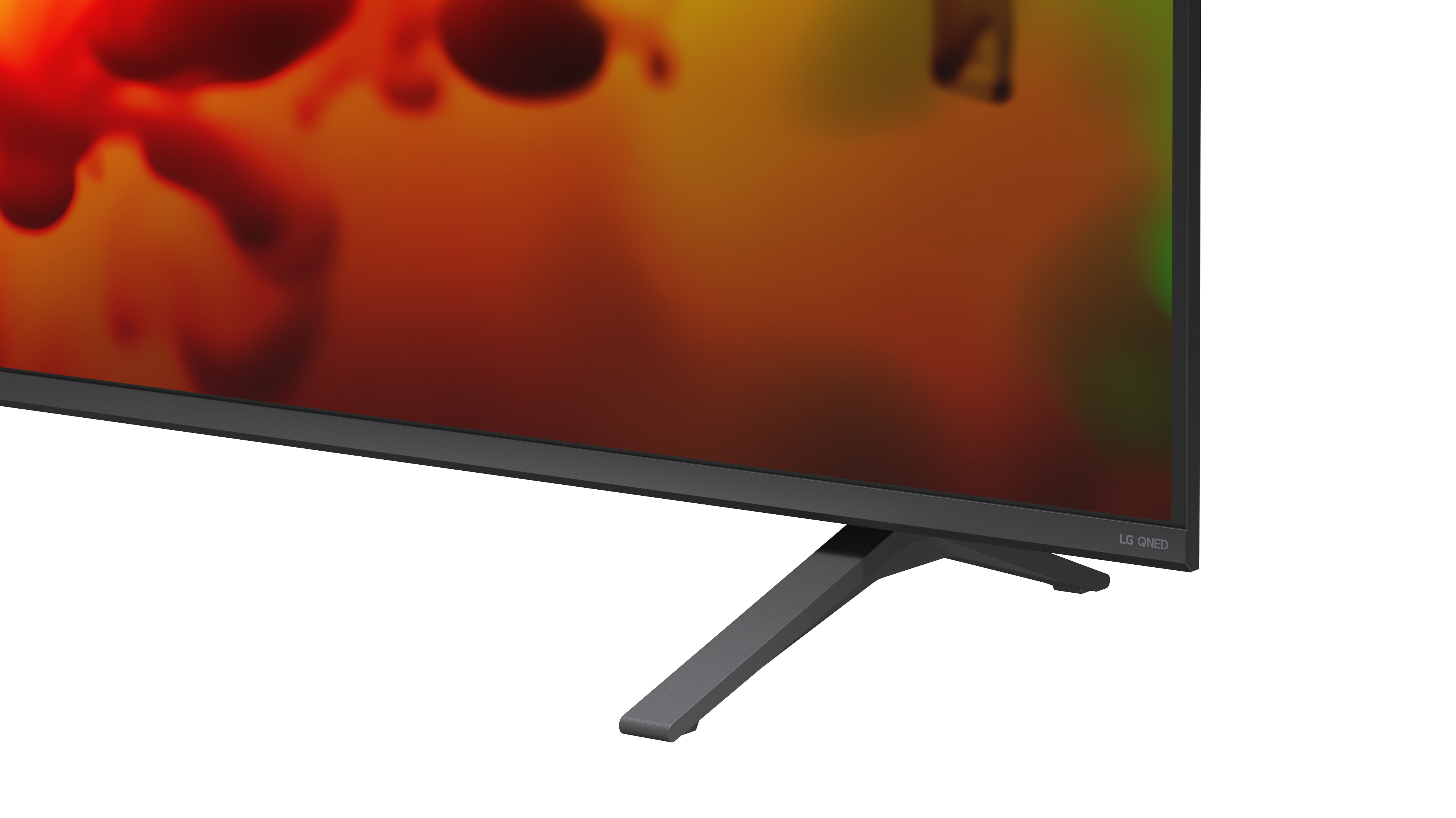 Ein moderner Fernseher mit breitem Fuß und abstraktem Hintergrund in Rot- und Orangetönen.