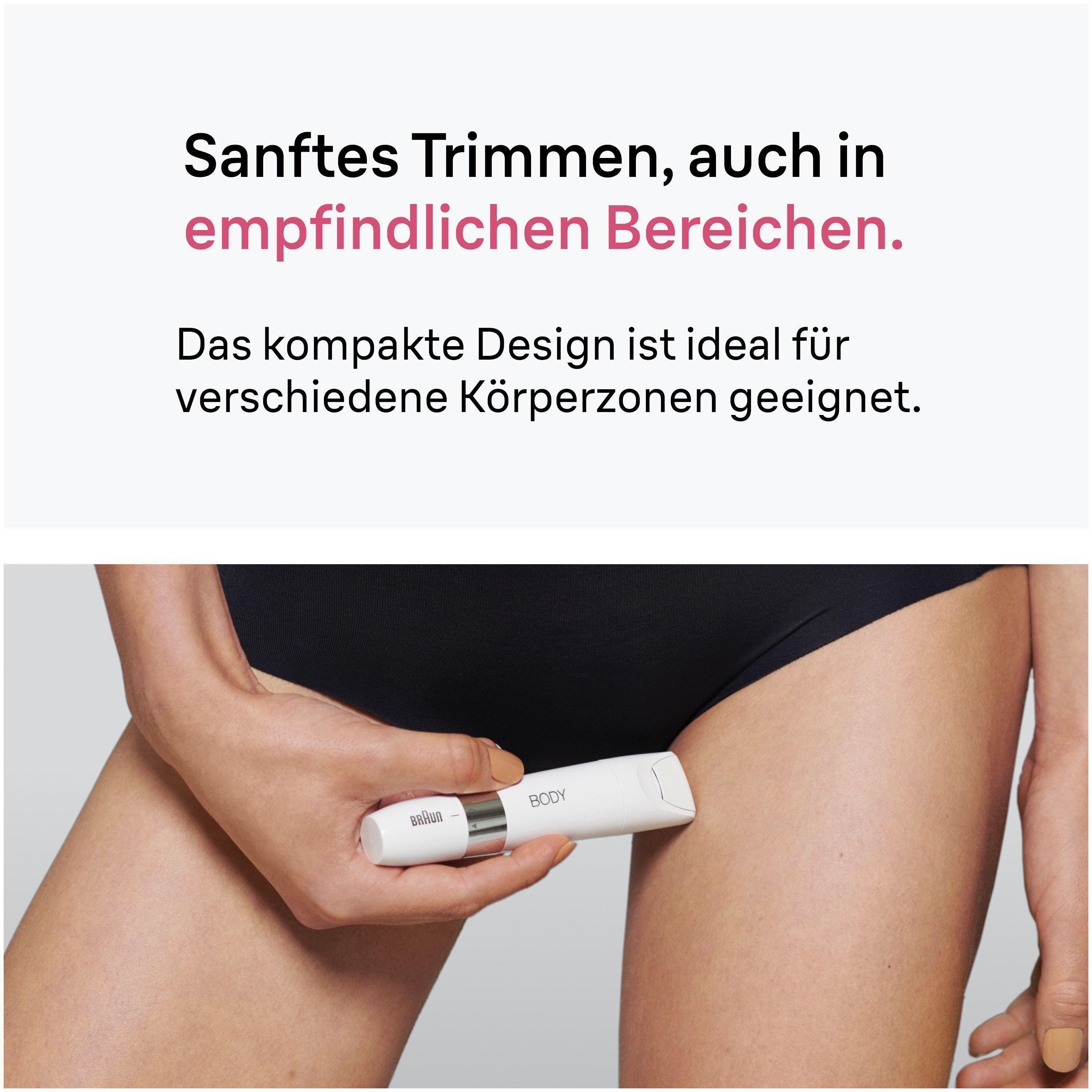 Eine Hand hält einen weißen Trimmer mit der Aufschrift 'BODY' an der Haut.