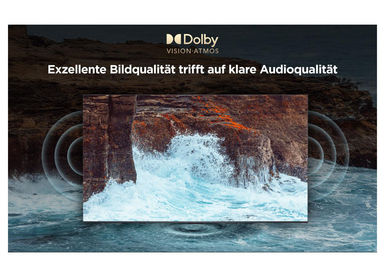 Wellen schlagen gegen Felsen, Dolby Vision Atmos Logo oben.