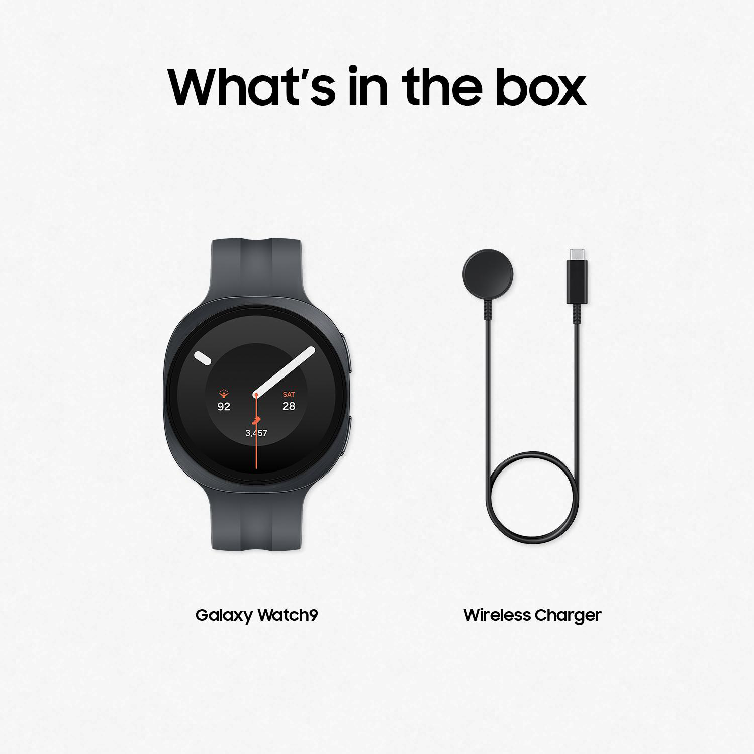Graue Galaxy Watch9 und schwarzes Wireless Ladegerät mit USB-C-Kabel.