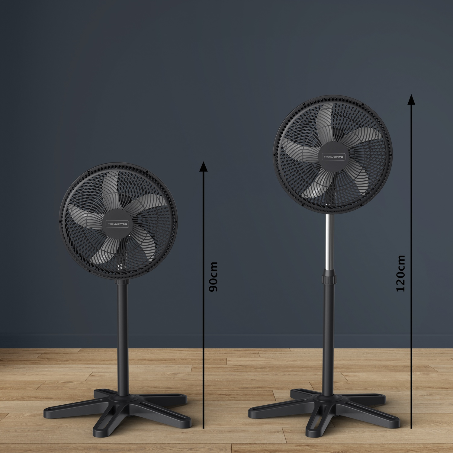 Two black pedestal fans, 90cm and 120cm tall, on a wooden floor.