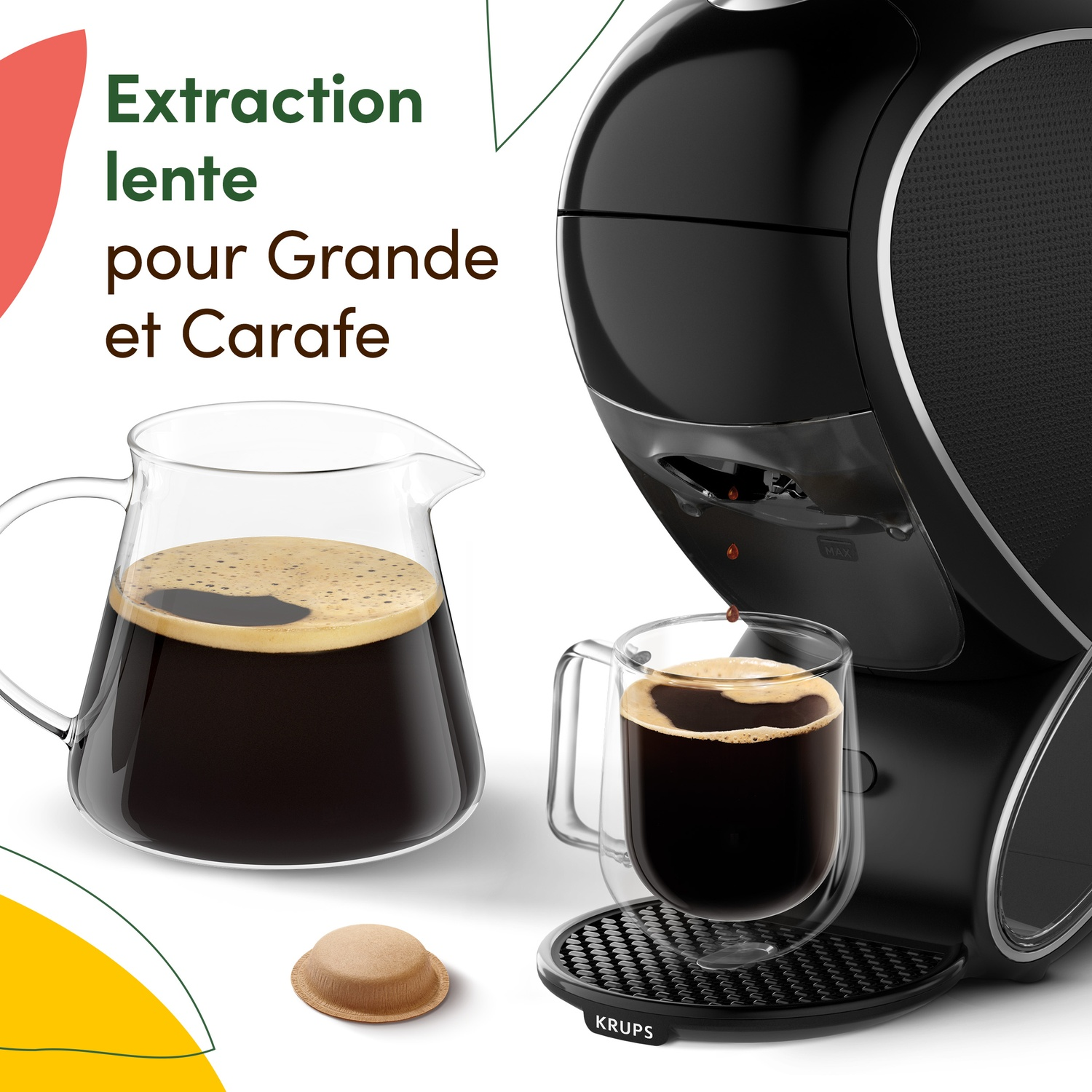 Black coffee machine with carafe and cup filled with coffee.