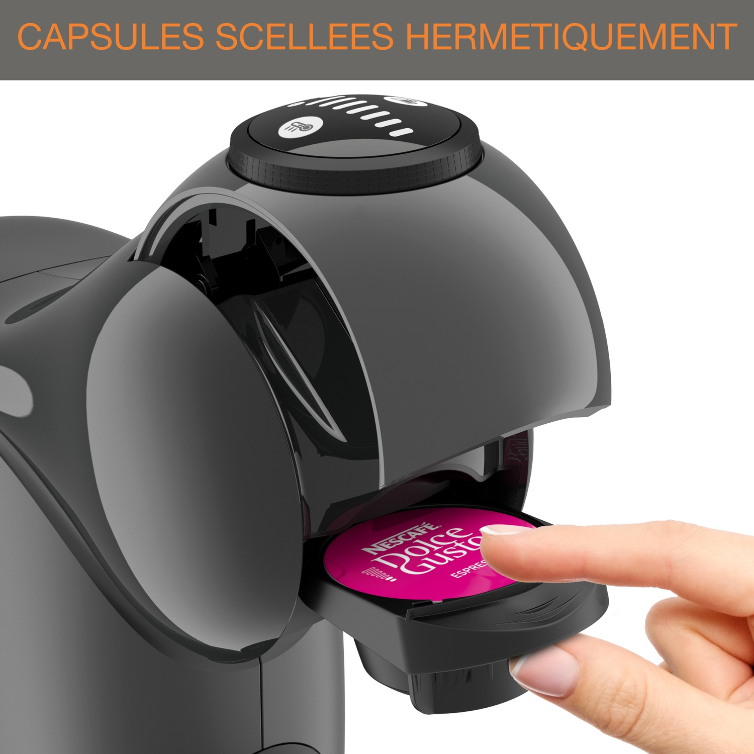 A hand inserts a pink Nescafe Dolce Gusto capsule into a coffee machine.