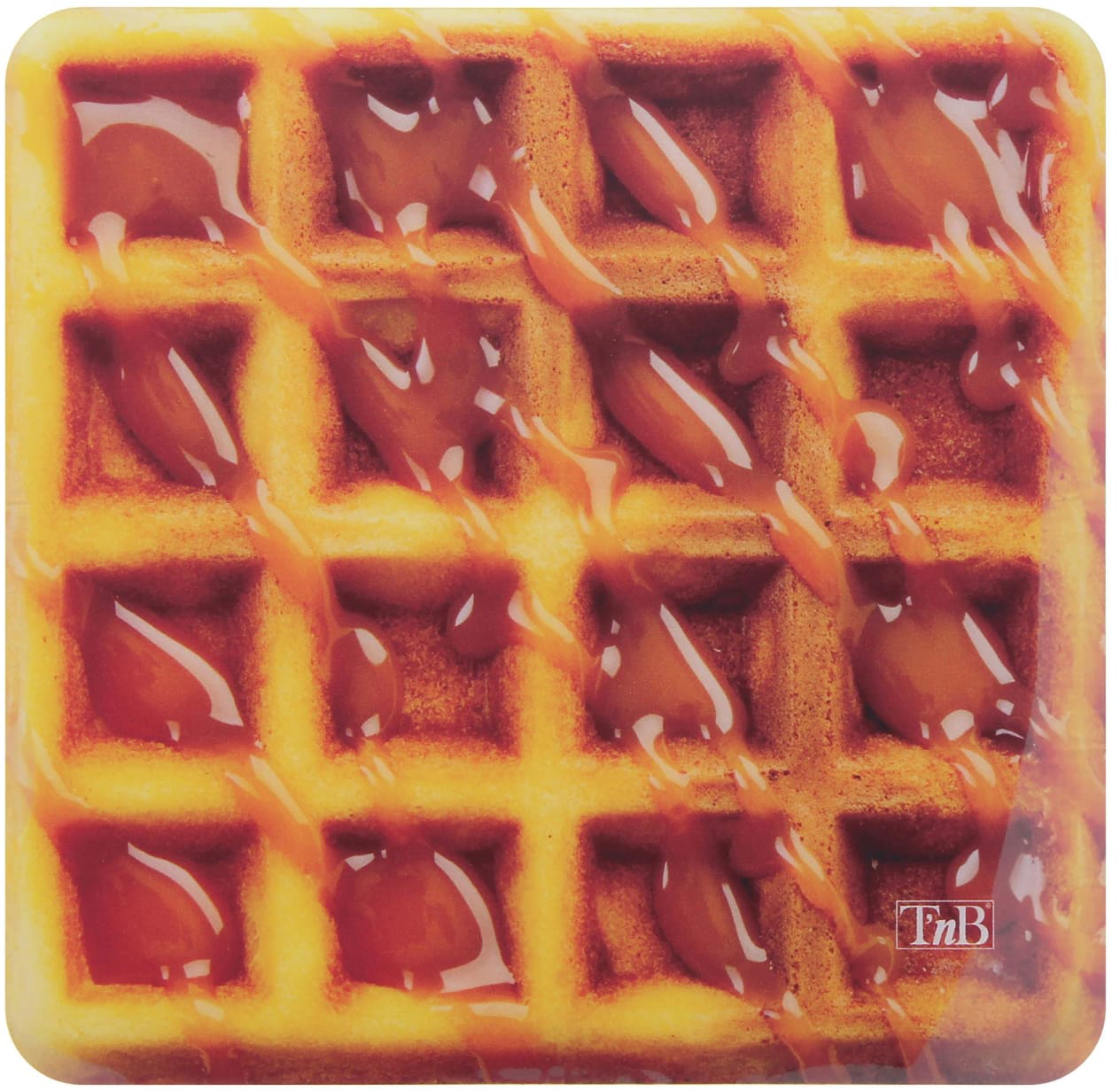 Egy aranybarna gofri karamellszínű mázzal, amely a felületére csöpög.