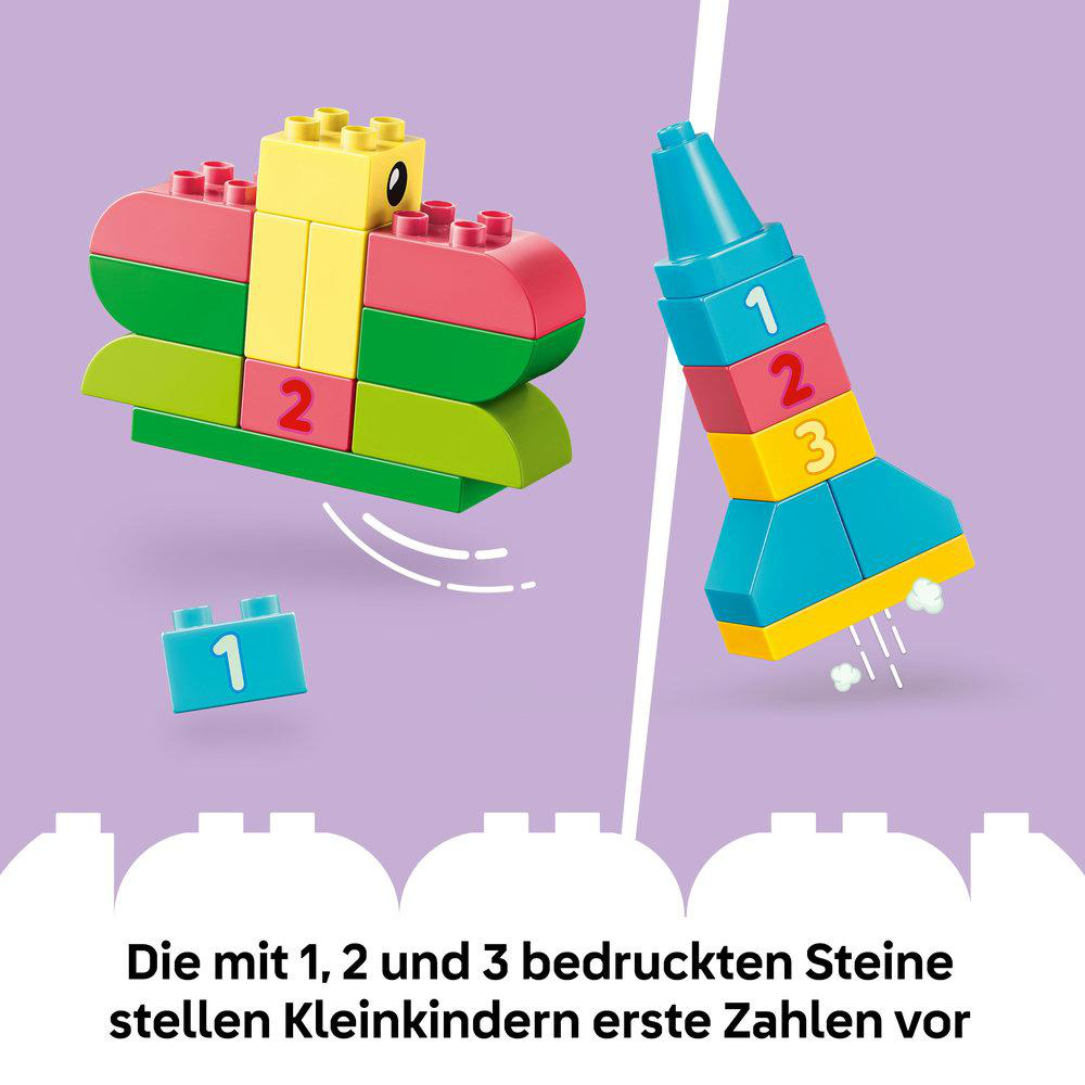 Bunte Bausteine mit Zahlen 1, 2 und 3 auf lila Hintergrund.