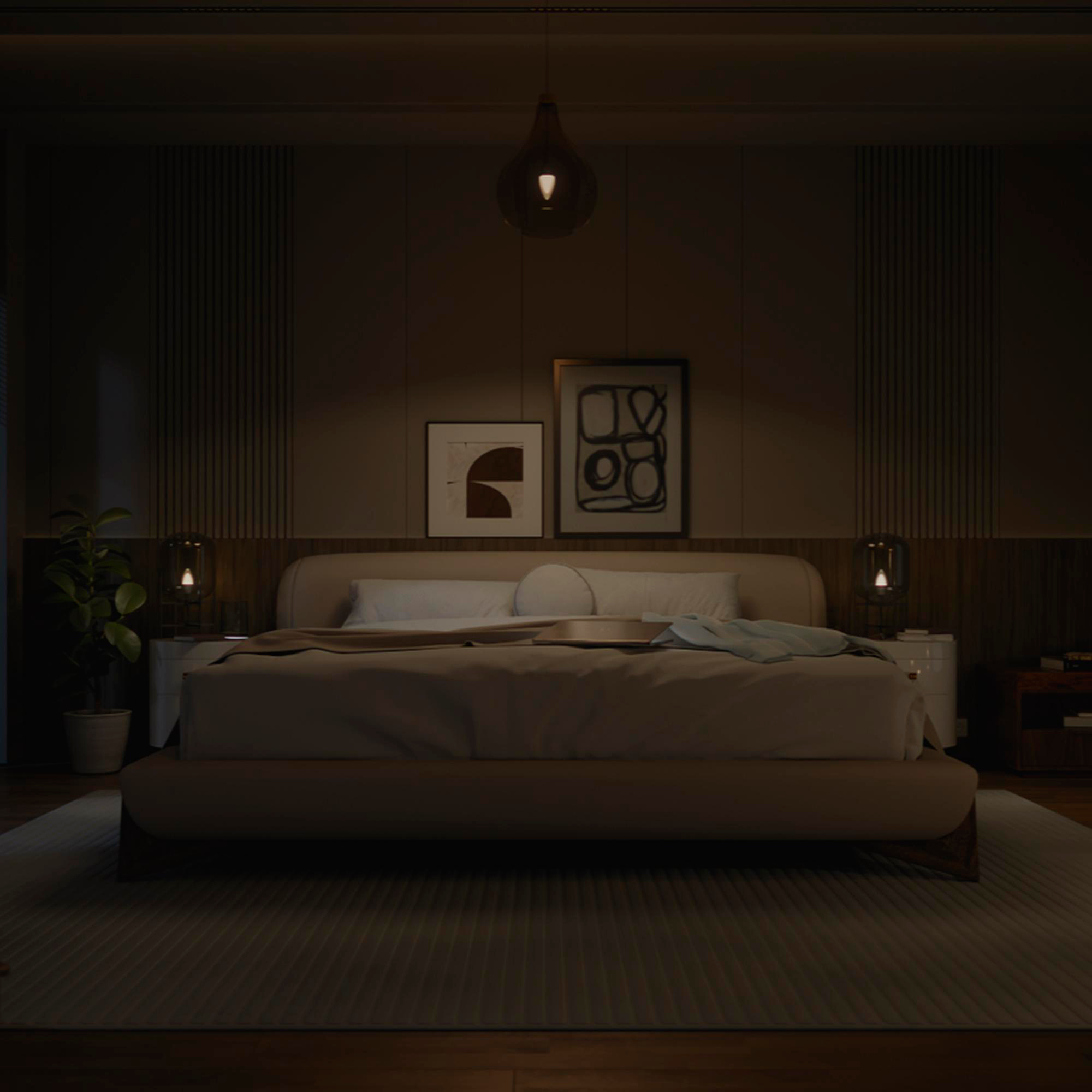 Ein dunkles Schlafzimmer mit einem großen Bett, Nachttischen und Kunst an der Wand.