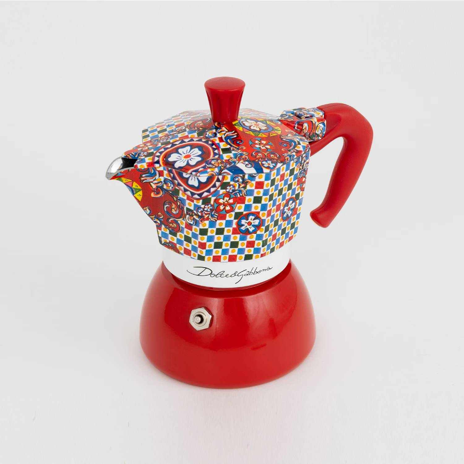 Cafetera moka roja con parte superior estampada y colorida, con logo Dolce & Gabbana.