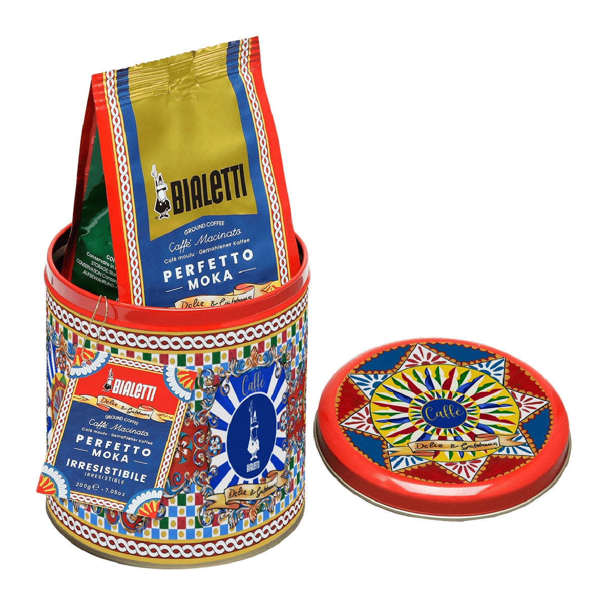 Una lata de café Bialetti roja con dos paquetes de café y una tapa.