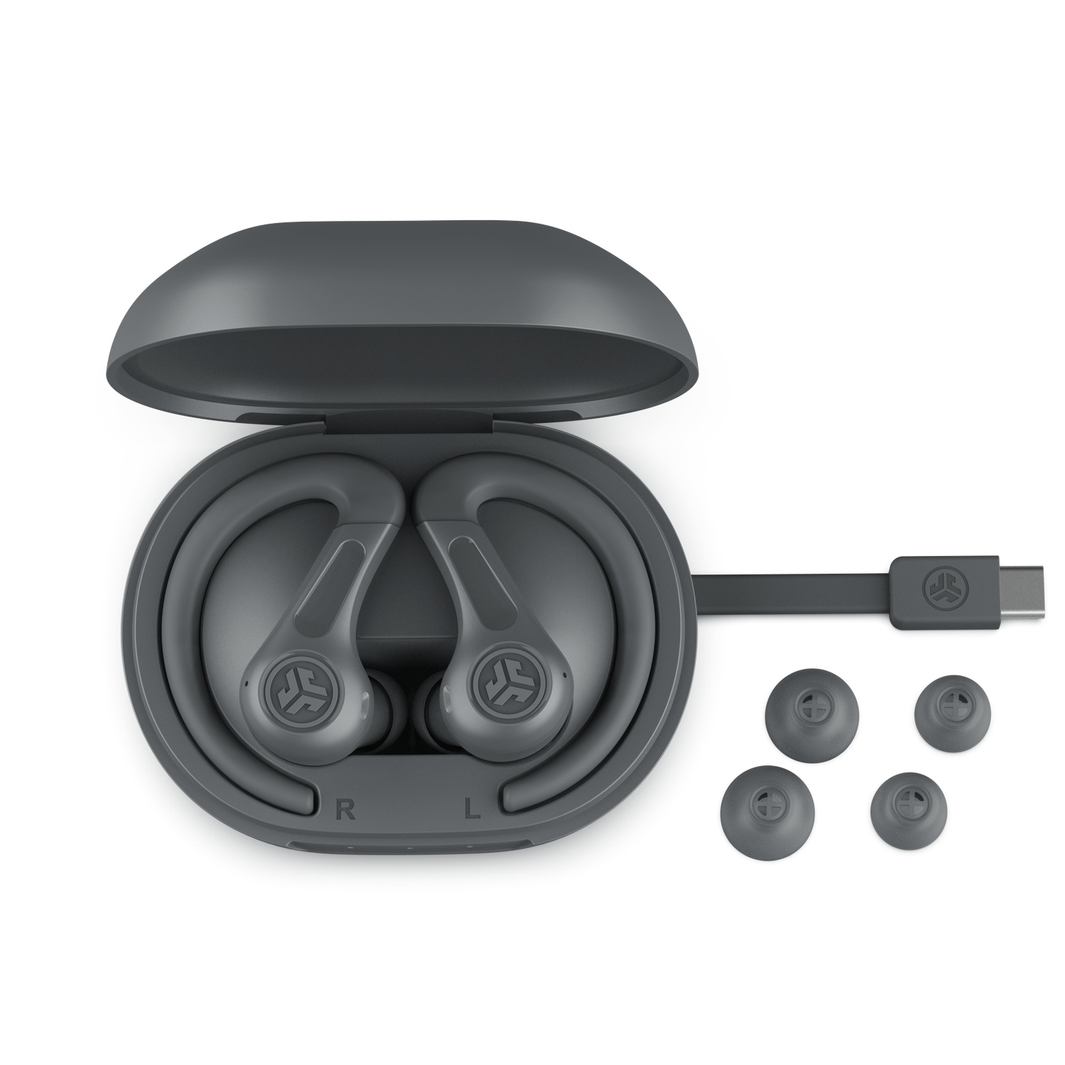 Gray wireless earbuds in an open charging case with charging cable and tips.