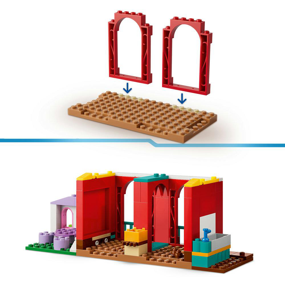 Bunte Lego-Bausteine bilden ein Gebäude mit Bögen und einem Dach.