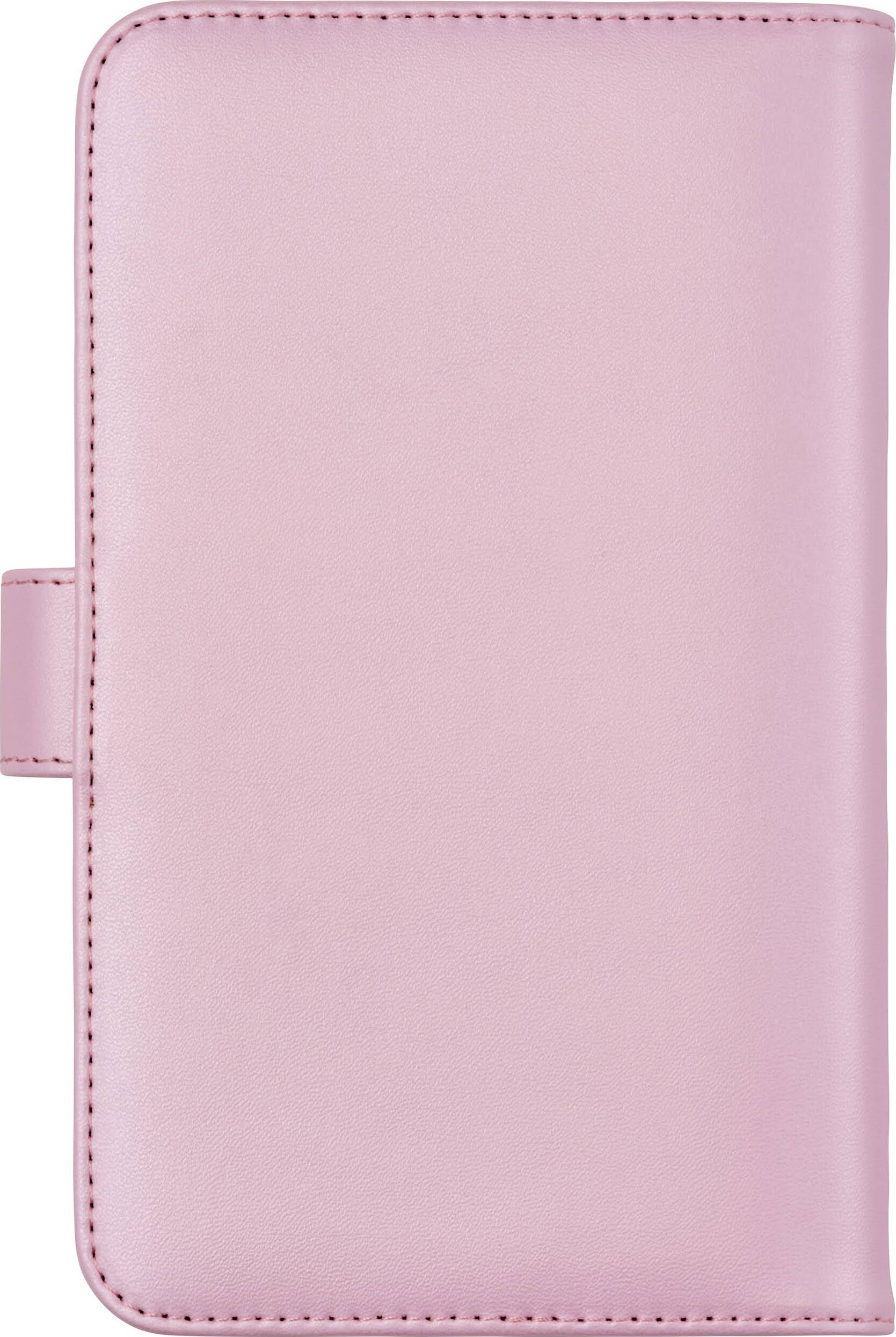 Une couverture en cuir rose avec des coutures. Elle est fermée.