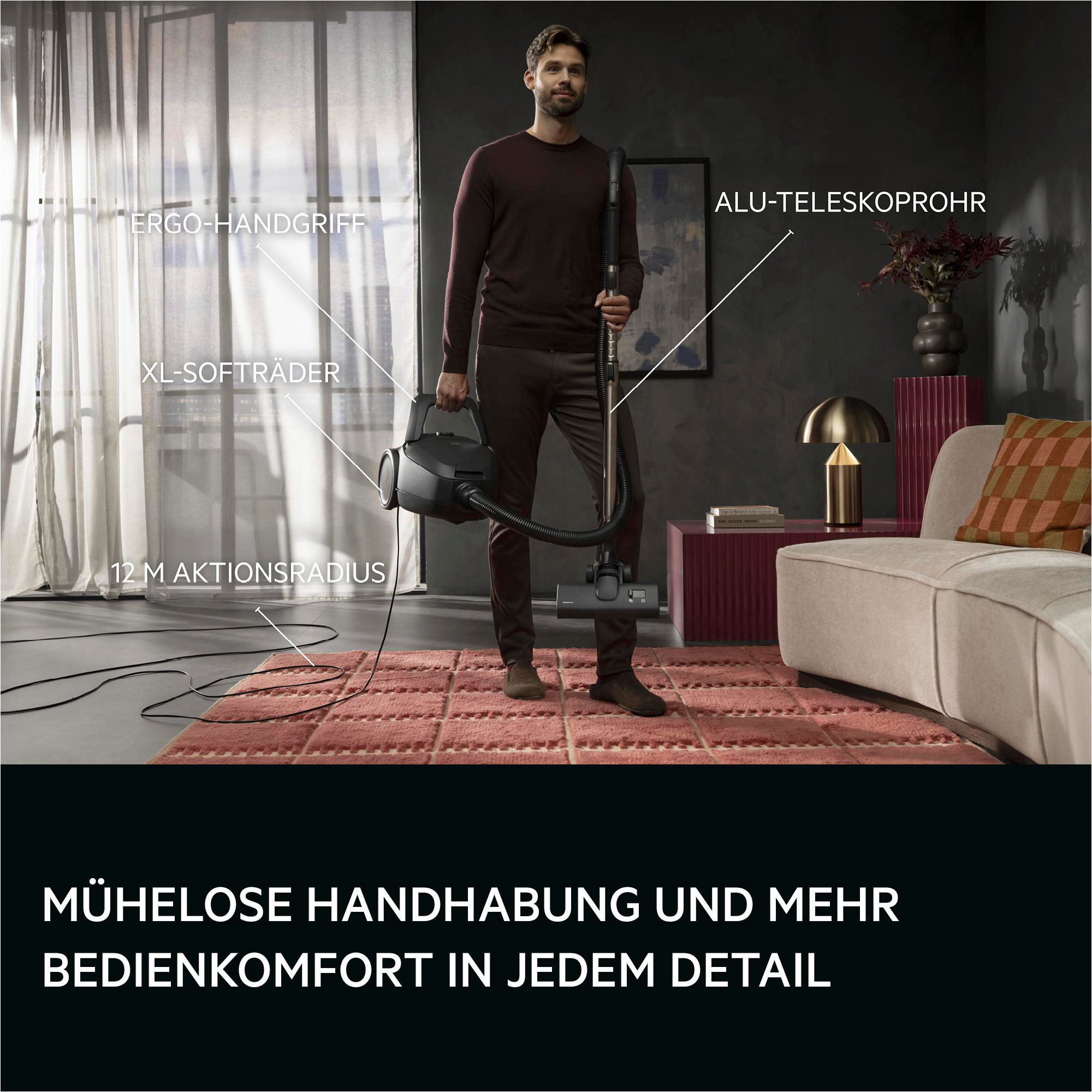Mann mit Staubsauger: ergo Griff, XL Räder, 12m Radius, Alu-Rohr.