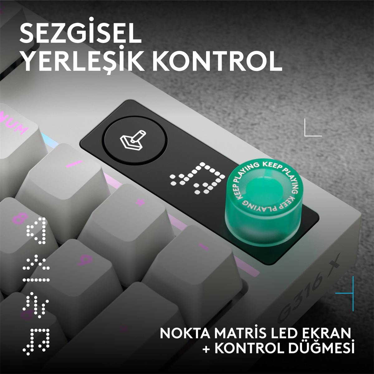 Yeşil döner düğmeli ve LED ekrana sahip gri klavye. Yazı: "KEEP PLAYING".
