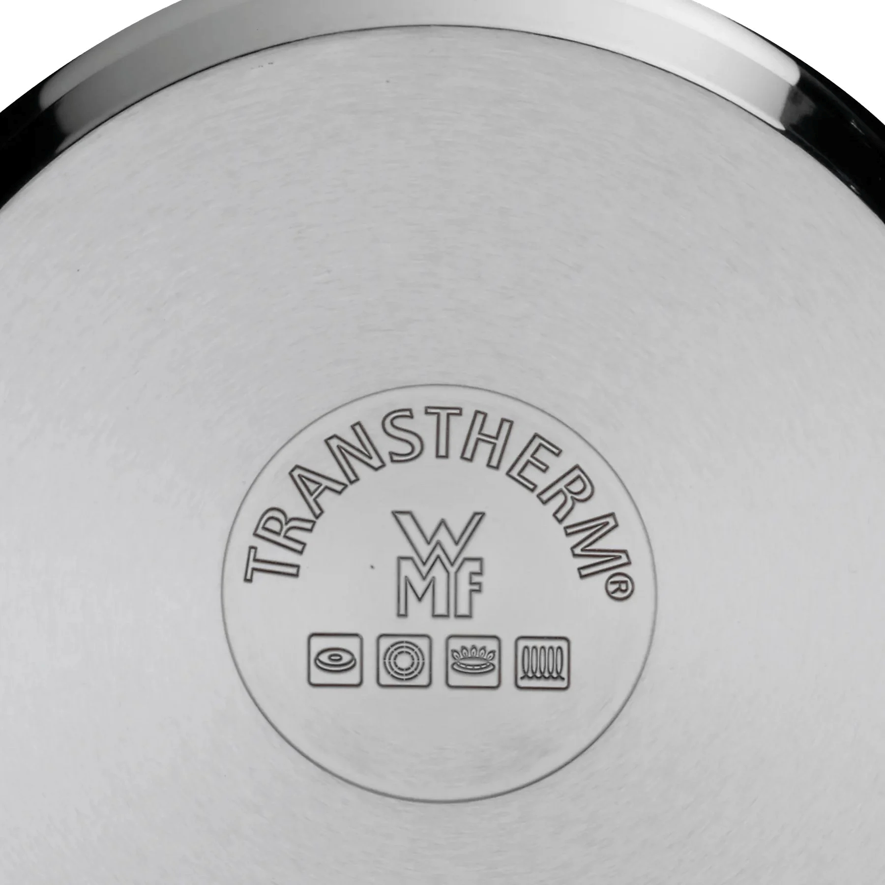 Unterseite eines Kochgeschirrs mit "TRANSTHERM" und "WMF" Logo.