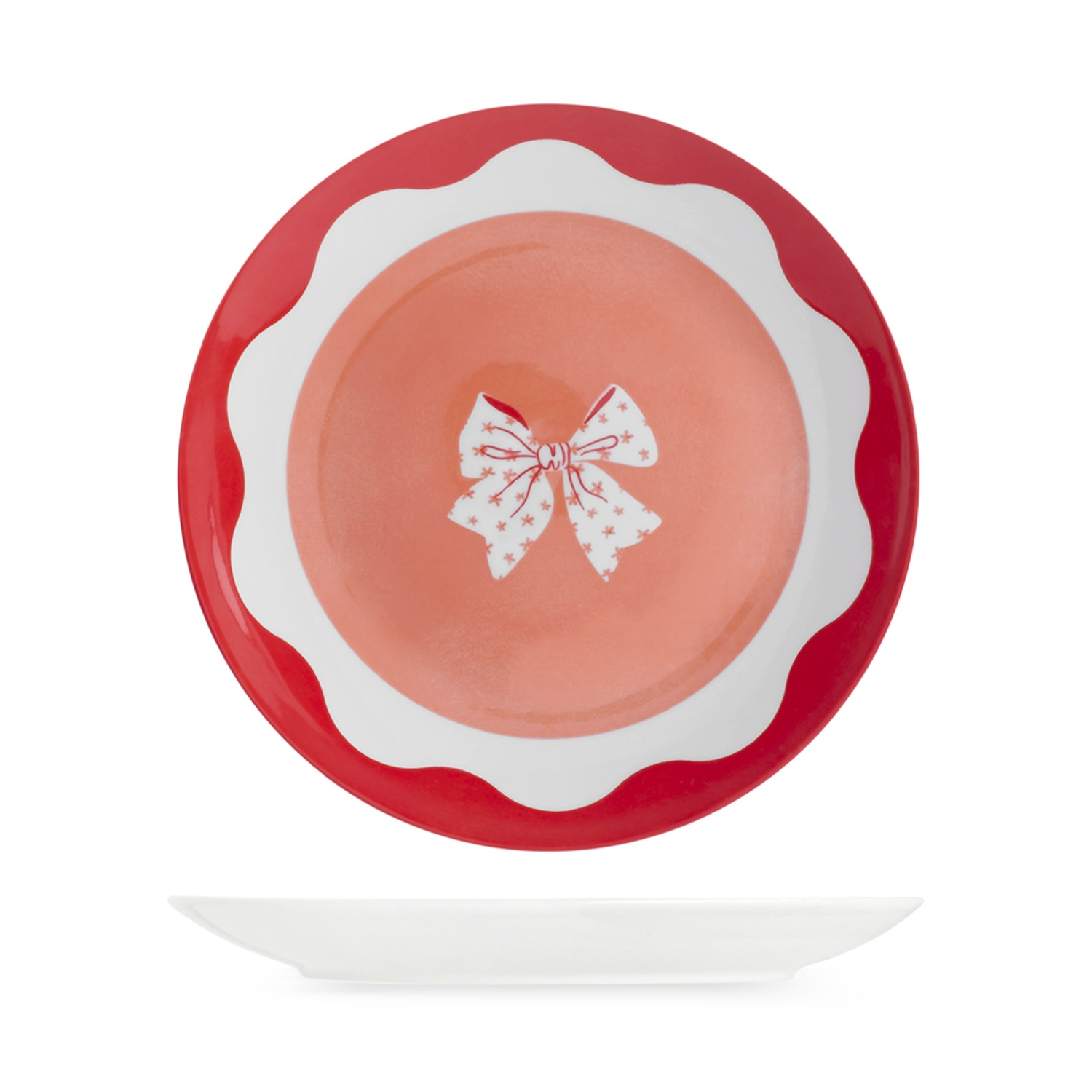 Un piatto a smerlo rosso e bianco con centro corallo raffigurante un fiocco bianco con stelle.