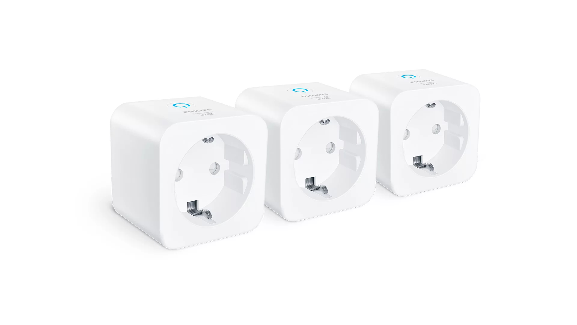 Tres enchufes inteligentes Philips Hue blancos con símbolos azules, uno al lado del otro.