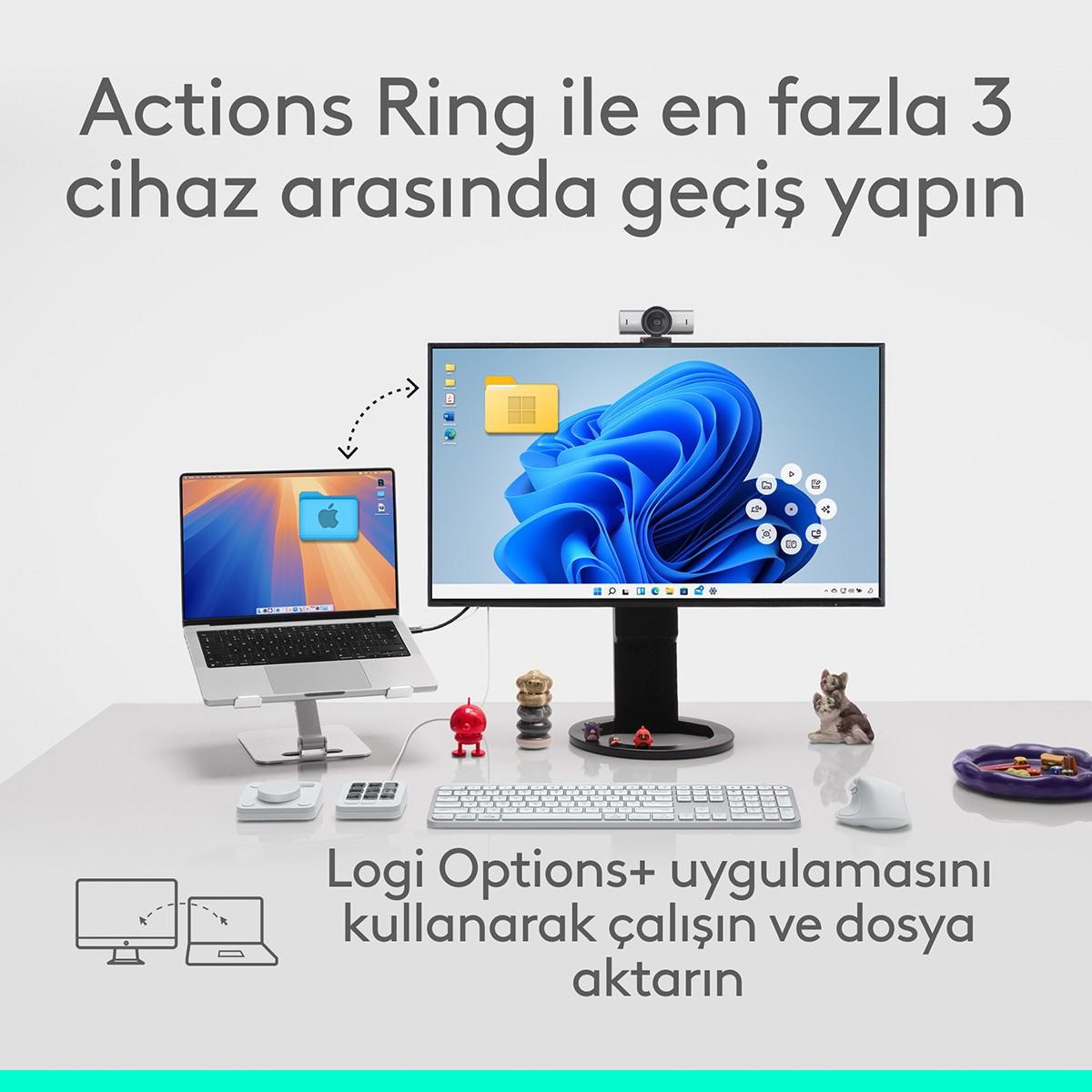 Bir dizüstü bilgisayar ve Windows 11 gösteren bir monitör masada görünüyor.