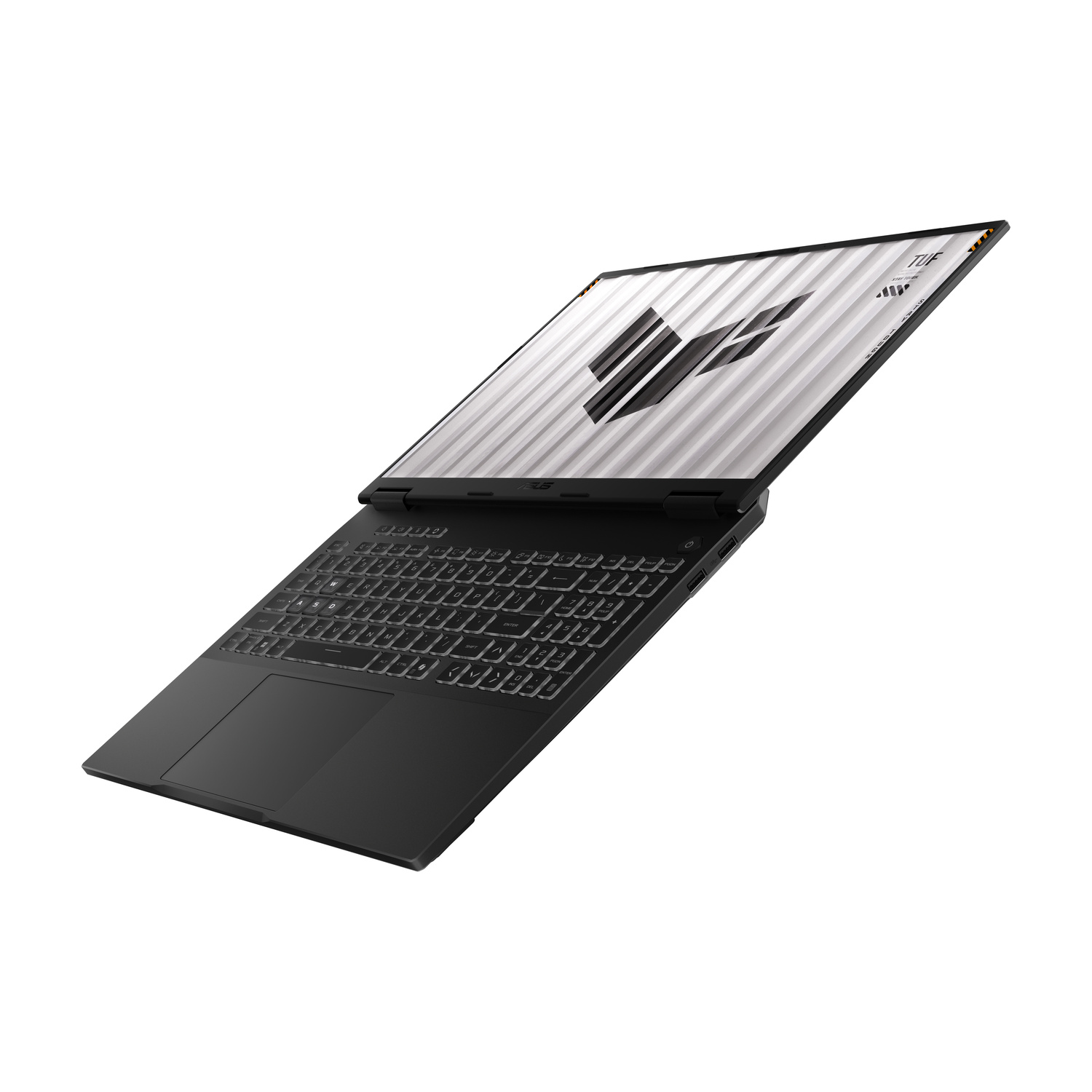 Laptop nero con tastiera illuminata e logo TUF sullo schermo.