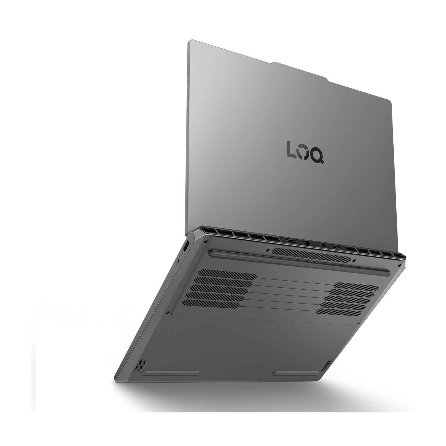 Un laptop grigio, visto dal basso e da dietro, con prese d'aria.