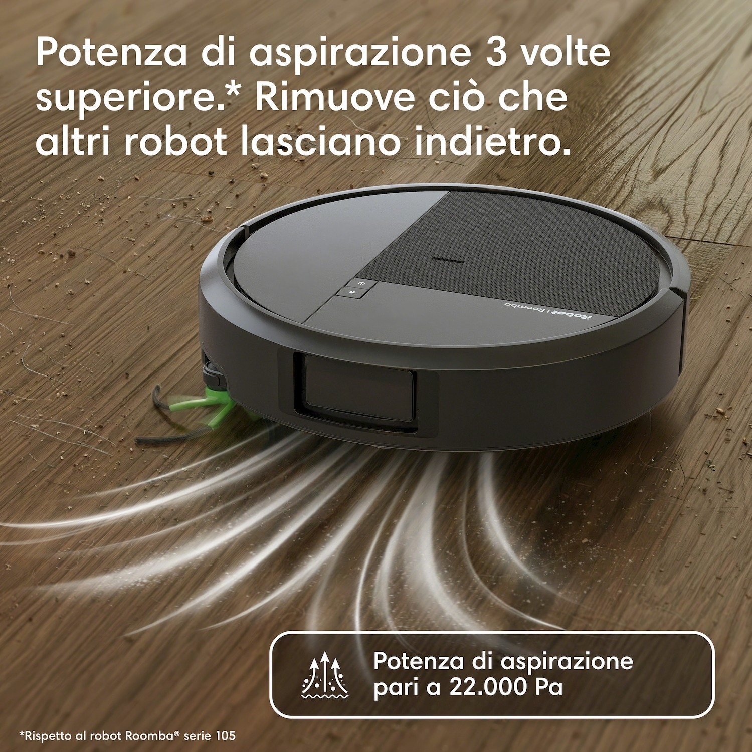 Un robot aspirapolvere nero pulisce polvere e detriti da un pavimento in legno.